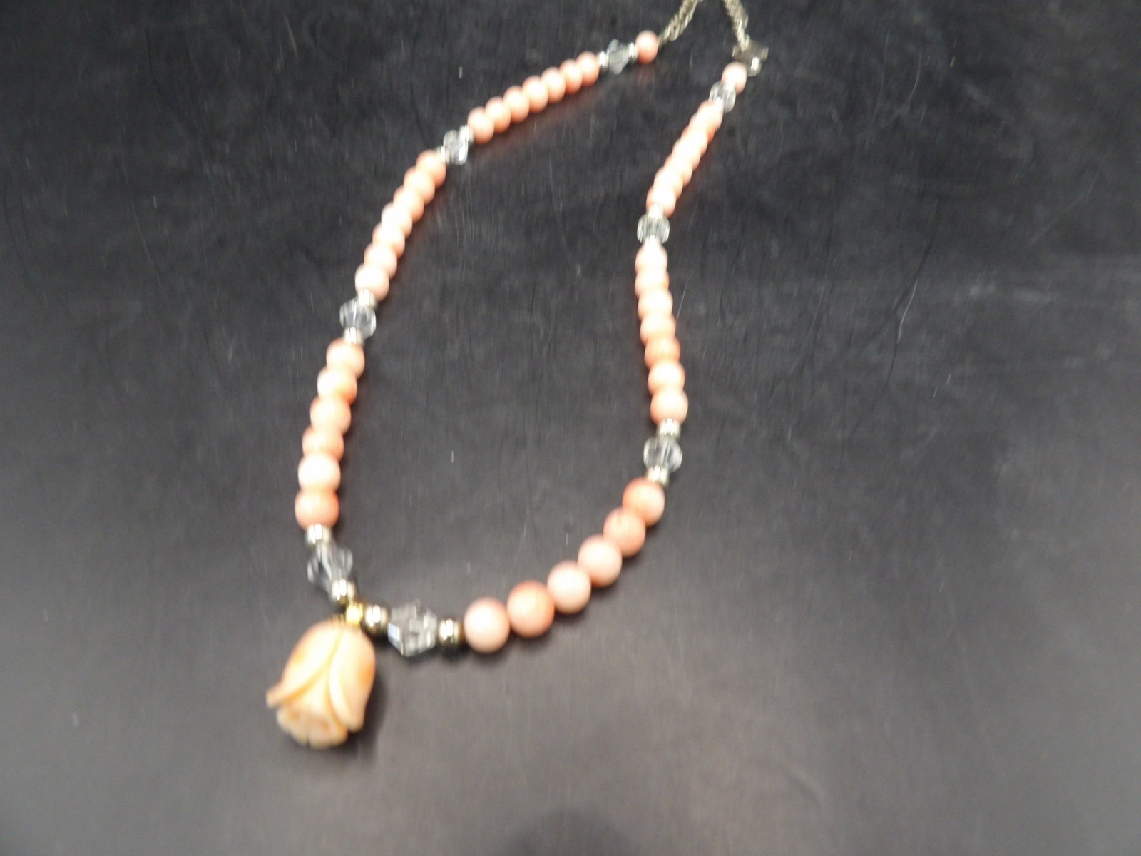 salmon color angel skin coral beaded necklace with floral pendant and sterling silver clasp: Marked 925 on clasp. 18 inches long. We will inhouse ship items to you very affordable and efficient. Select self-arrange shipping.