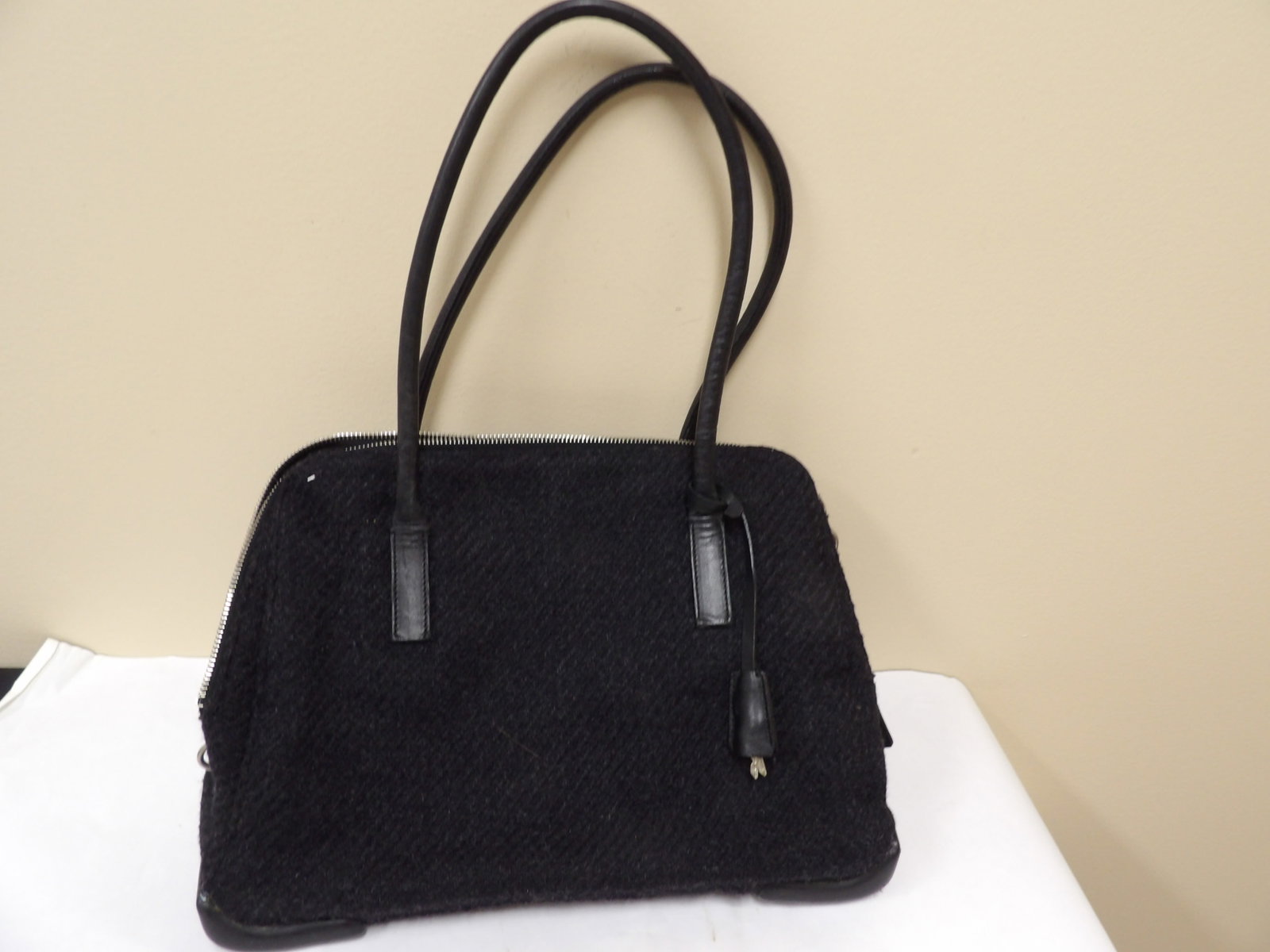 authentic Prada made in Italy wool handbag with leather handles and padlock charm: Bag is 12.5 x 3.7 x 9 inches. Total bag height including handle is 17.5 inches. Good vintage condition. We will inhouse ship items to you very affordable and efficient. Select self-arrange shipping.