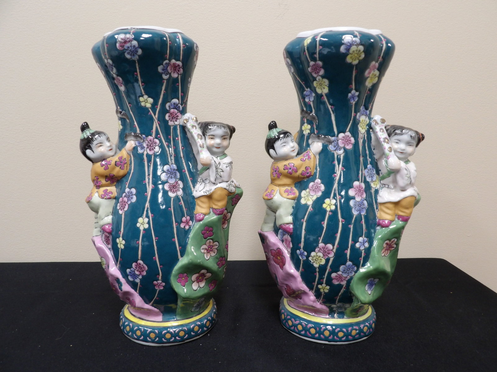 pair of Chinese porcelain vases with children climbing floral motifs and Qing dynasty Qianlong mark: 11 inches height. We will inhouse ship items to you very affordable and efficient. Select self-arrange shipping.