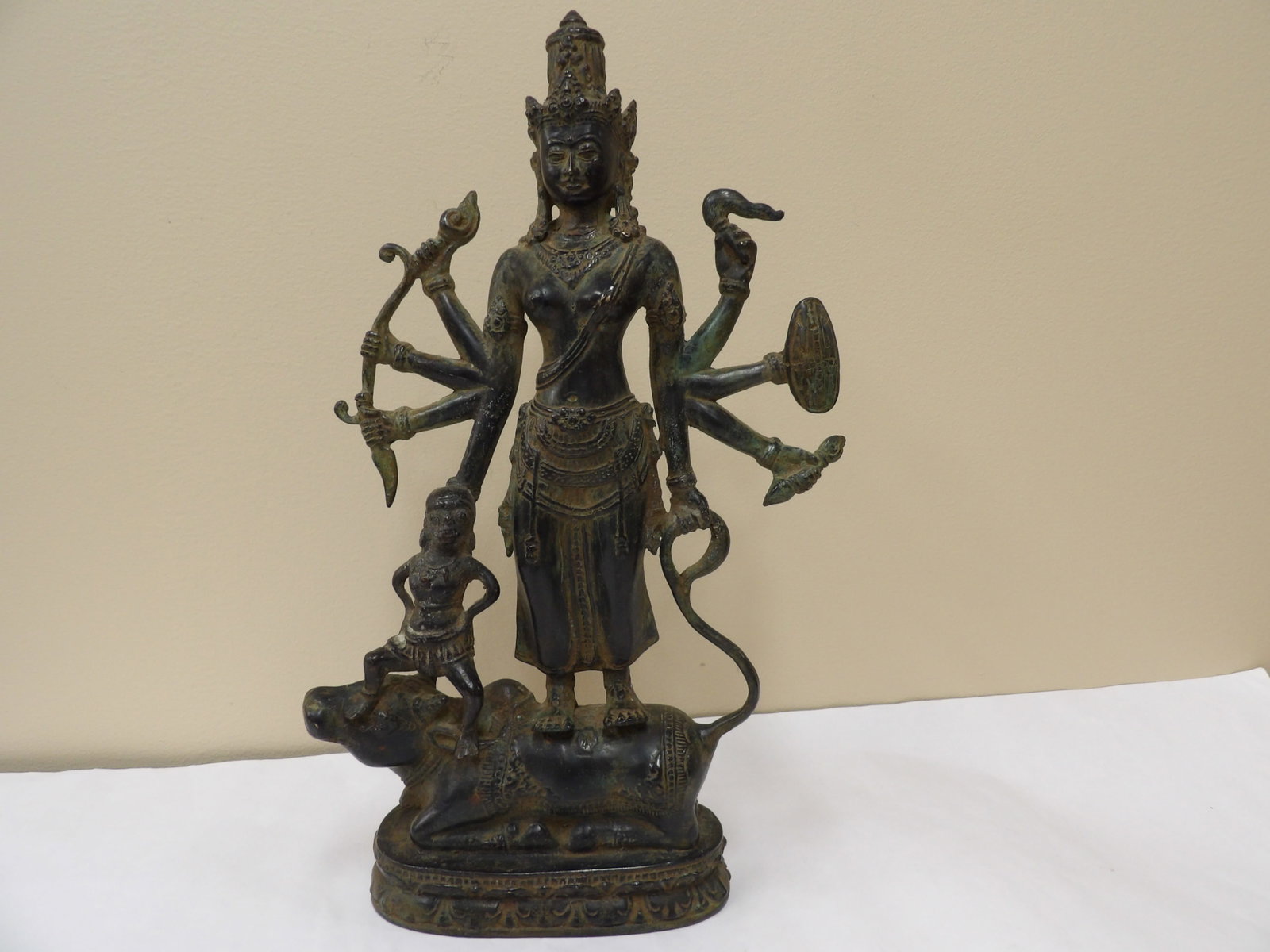 old Indian bronze statue of Goddess Durga on Nandi: Approx. 14 inches height. We will inhouse ship items to you very affordable and efficient. Select self-arrange shipping.