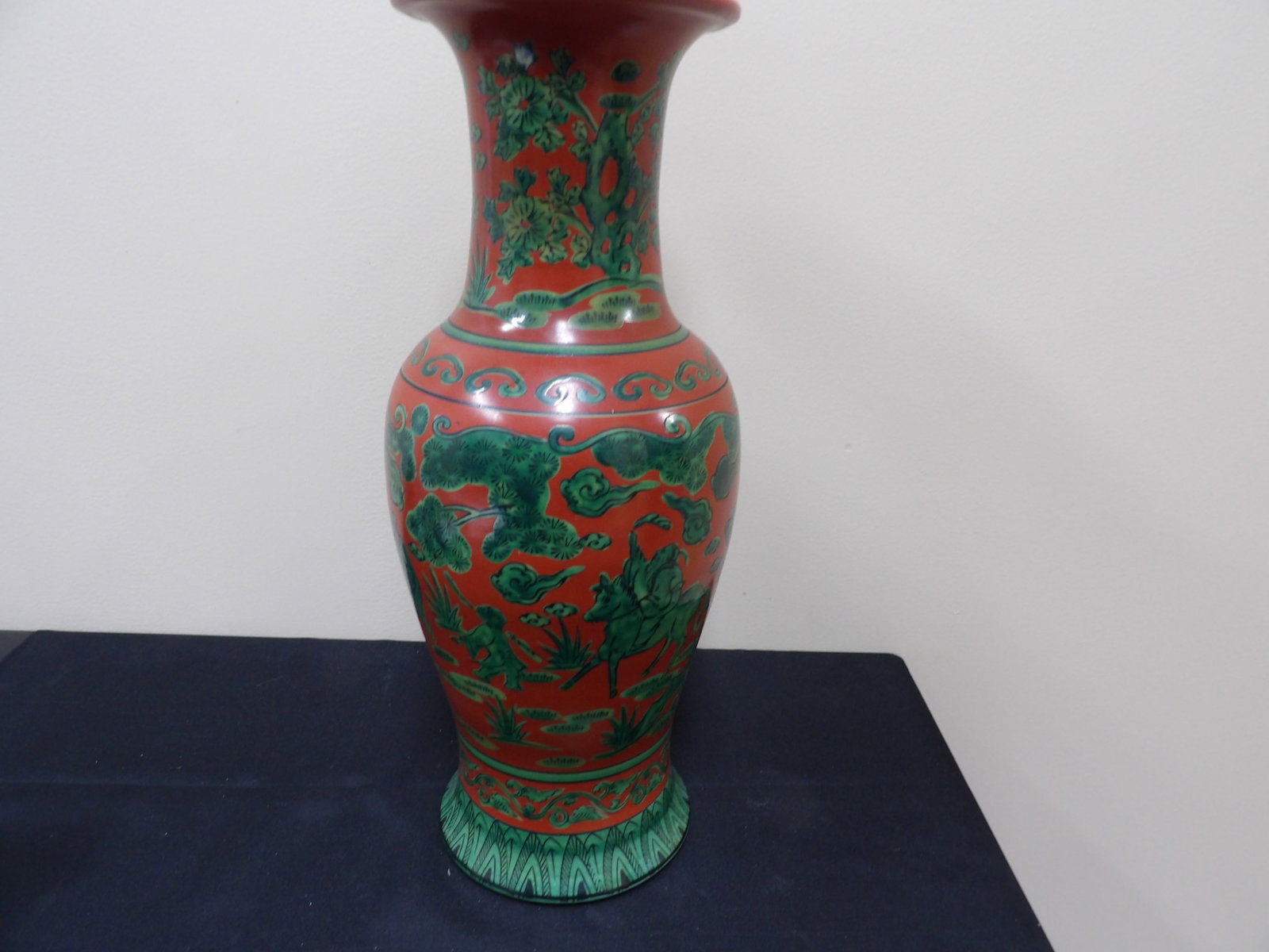 Chinese or Japanese red and green glazed vase with figural trees motifs: 16.5 inches height. We will inhouse ship items to you very affordable and efficient. Select self-arrange shipping.