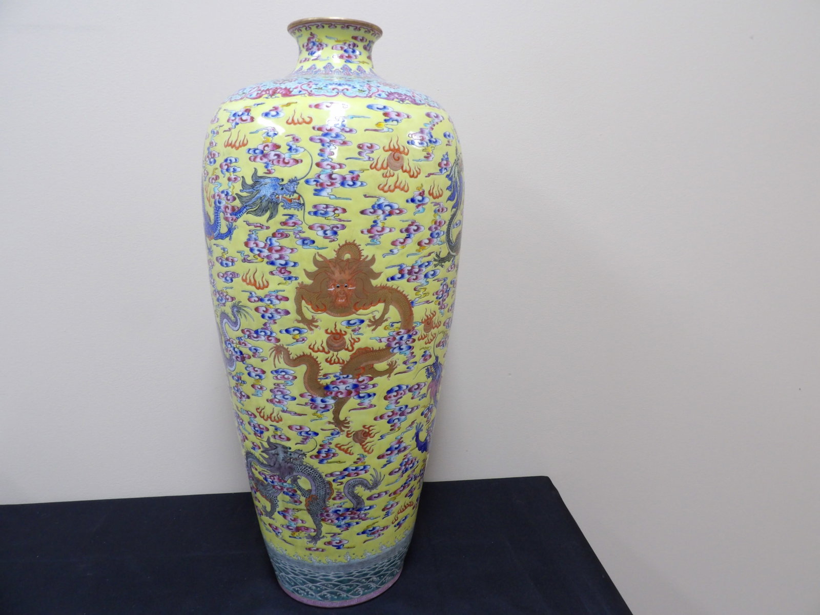 fine yellow ground Chinese porcelain vase with dragons clouds motifs and Qing dynasty Qianlong mark: Approx. 24 inches height. Signed Qing dynasty Qianlong mark on the bottom.