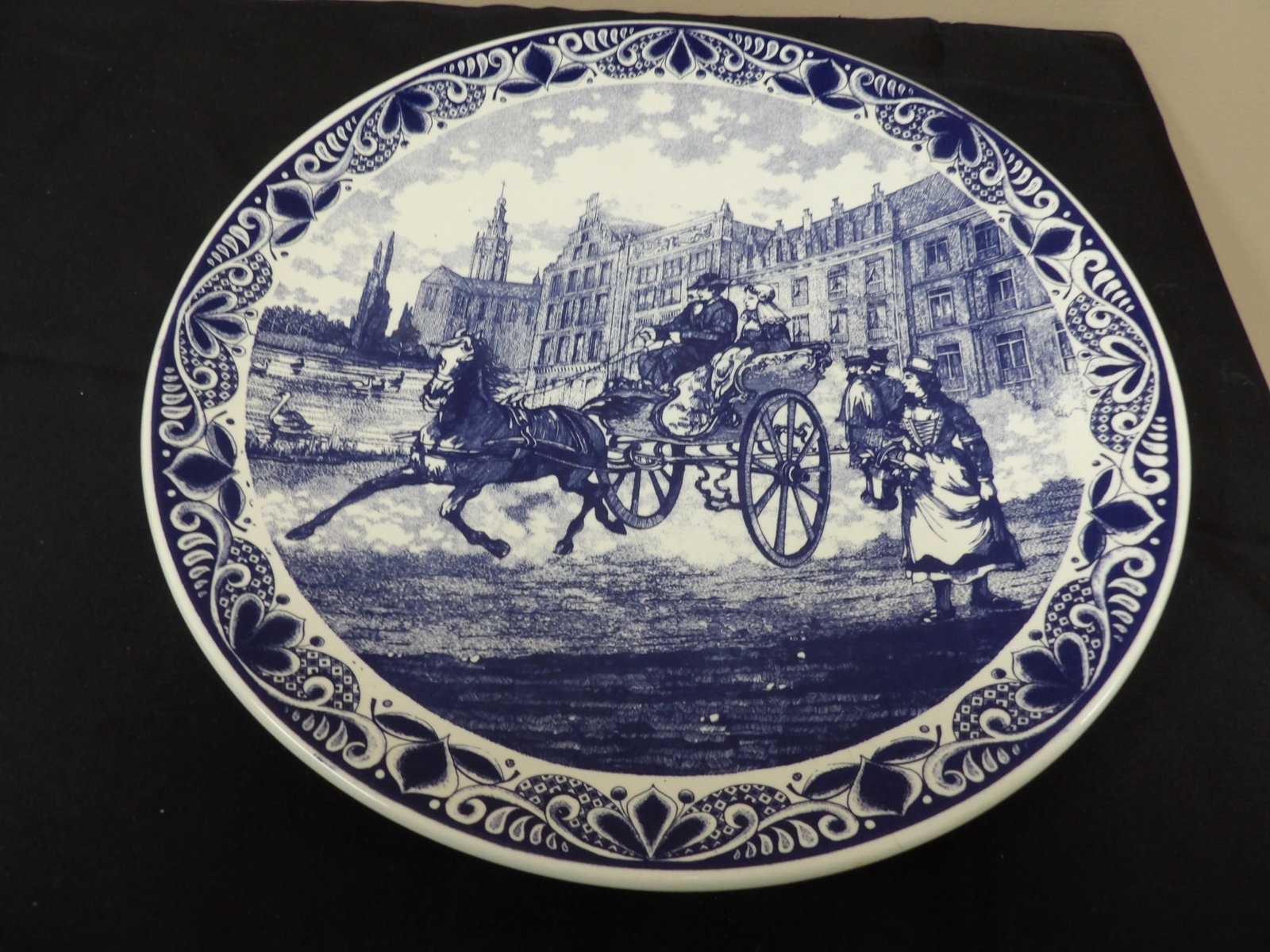 large hand painted blue and white Delftware porcelain wall charger plate: 15.4 inches diameter. Bottom has hanging holes and hook. Made in Holland. We will inhouse ship items to you very affordable and efficient. Select self-arrange shipping.