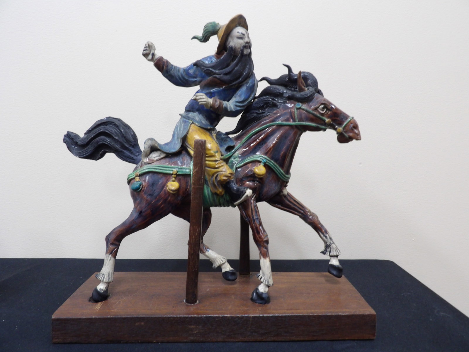 Qing dynasty Chinese antique polychrome roof tile of a warrior on horseback: Approx 14 inches length.