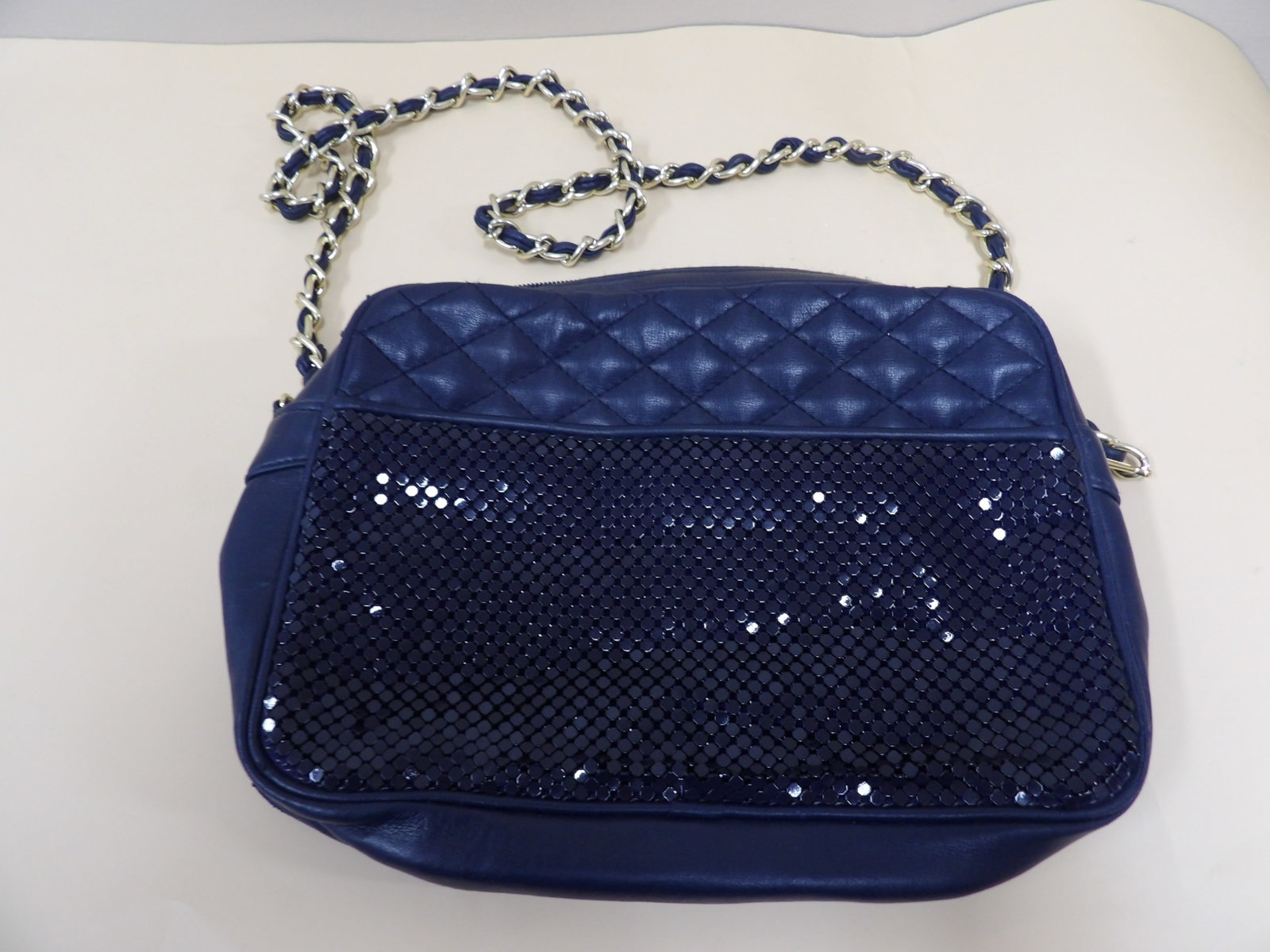 quilted leather and sequined mesh crossbody bag with multiple pockets and a small mirror: Approx size is 10 x 7.5 x 1.5 inches. Mirror is marked Soon Heung on the back. Bag was made in China.