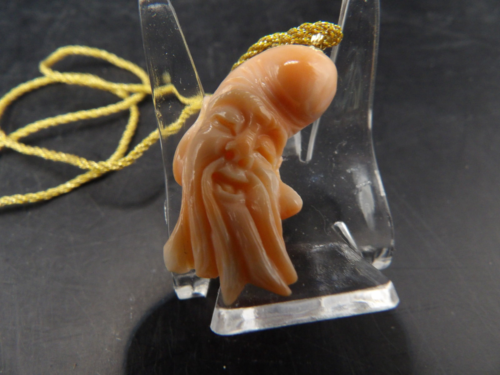 angel skin coral carved Longevity God pendant with 14k gold bail: Pendant including bail is 1.3 inches height. Necklace is gold color cord. We will inhouse ship items to you very affordable and efficient. Select self-arrange shipping.