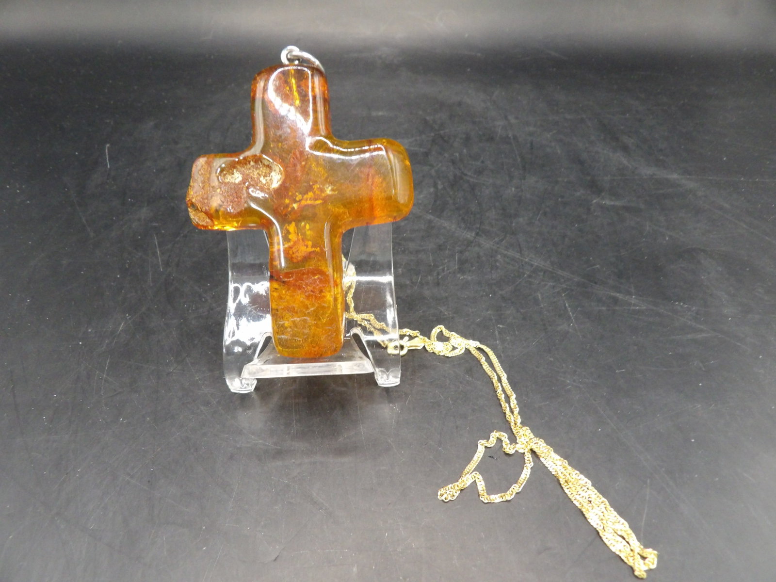 natural amber carved cross pendant and 18k gold 24 inches long necklace: 4.4 grams 24 inches long necklace is marked and tested as 18k. Cross pendant is 2.5 inches height not including bail. We will inhouse ship items to you very affordable and efficient. Select self-arran