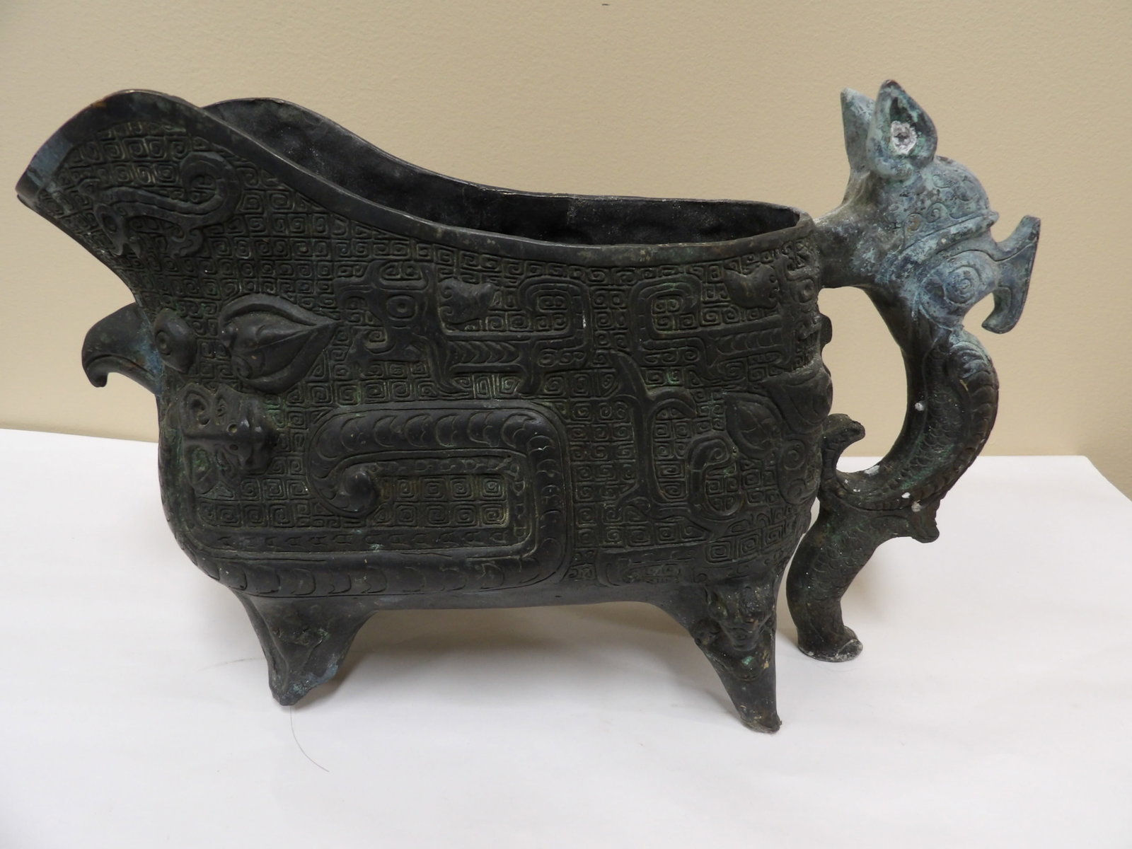 Chinese bronze vessel with dragon handle: 13 inches length. We will inhouse ship items to you very affordable and efficient. Select self-arrange shipping.