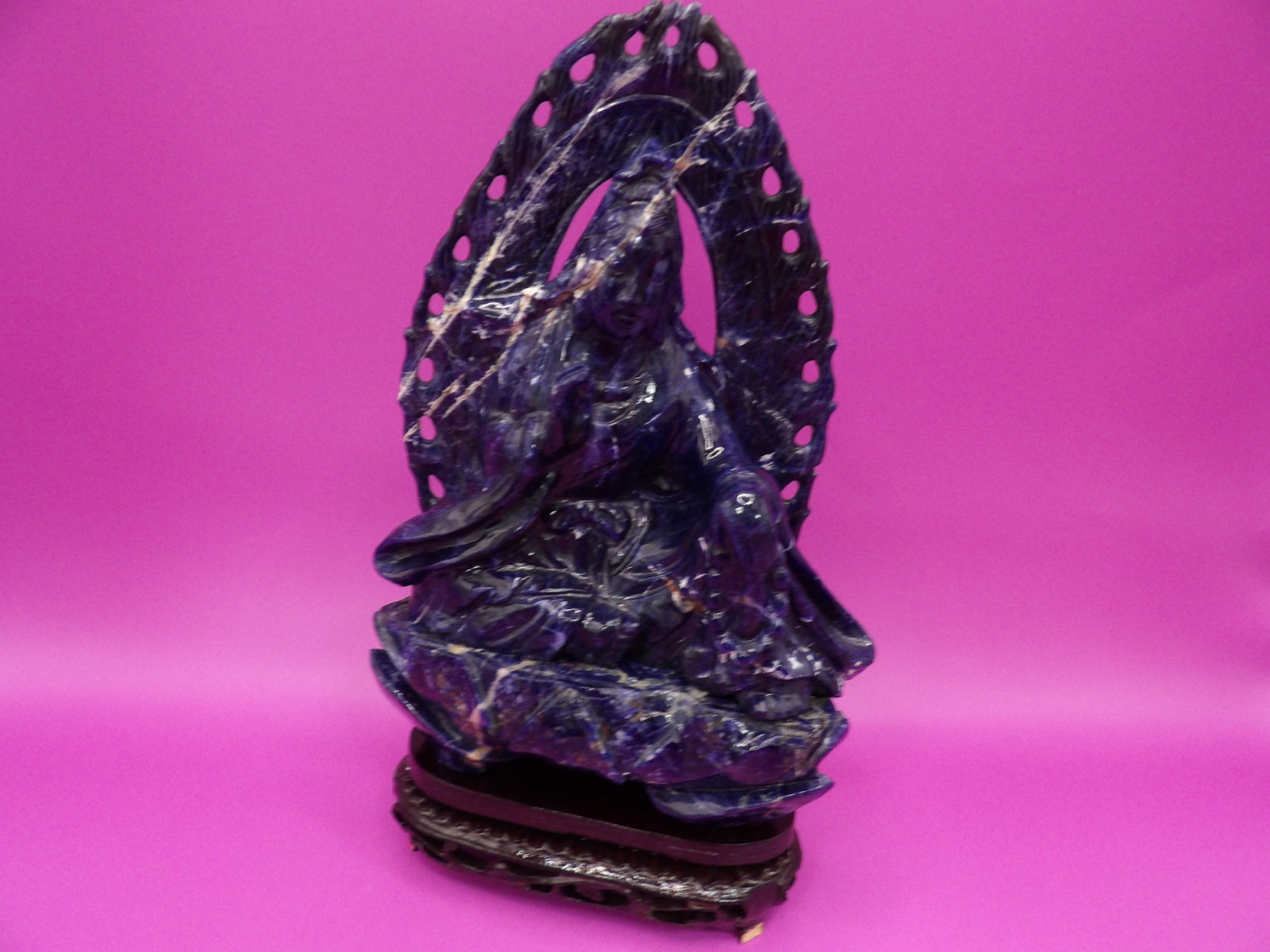 Chinese lapis lazuli Kwan Yin carving with custom wooden stand: Statue 7.3 inches height. With wooden base total height is 8.5 inches. We will inhouse ship items to you very affordable and efficient. Select self-arrange shipping.