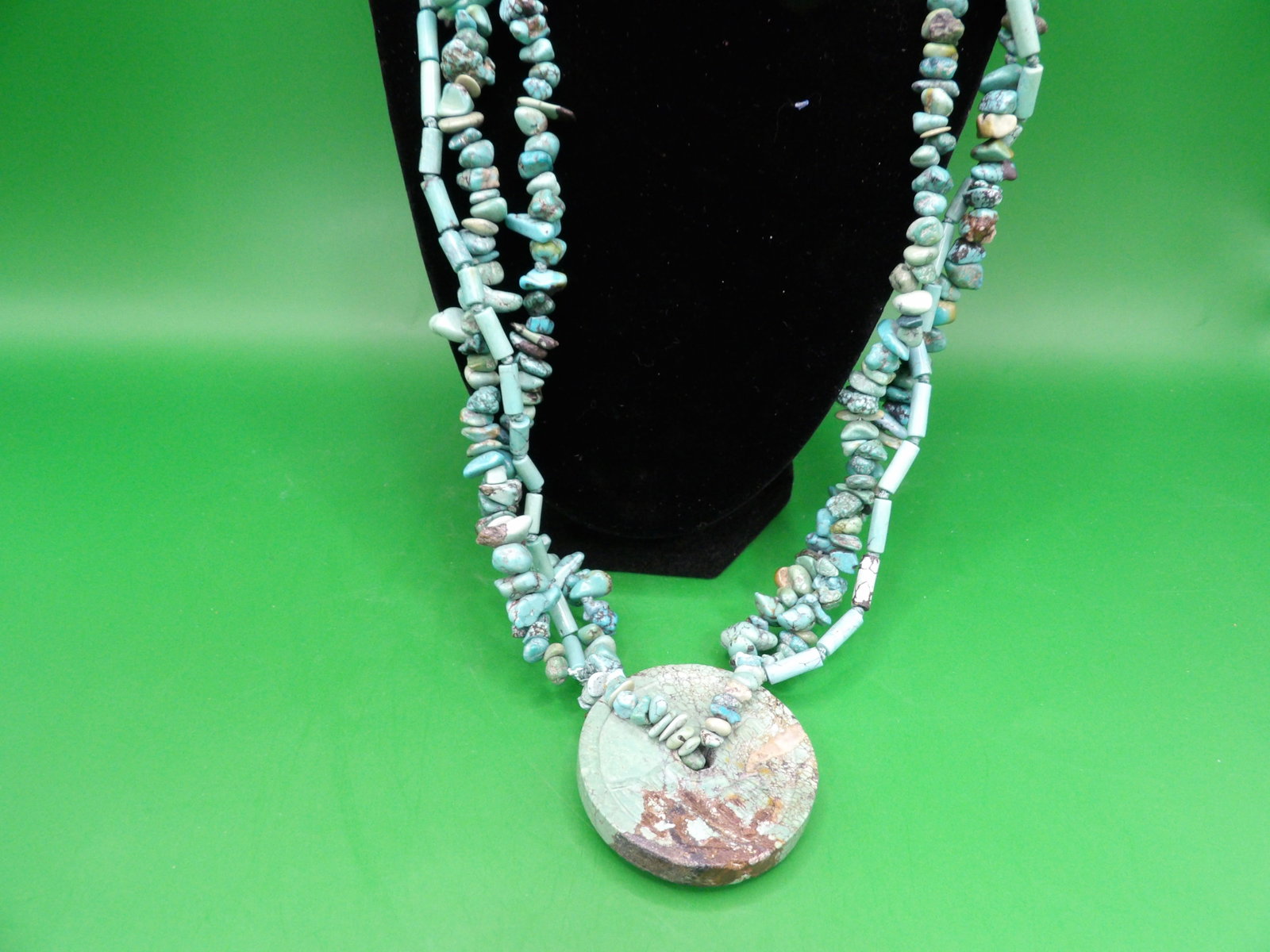 Chinese turquoise carved coin shaped pendant 3 strands necklace: Pendant is 1.7 inches diameter. 24 inches long 3 strands necklace. We will inhouse ship items to you very affordable and efficient. Select self-arrange shipping.