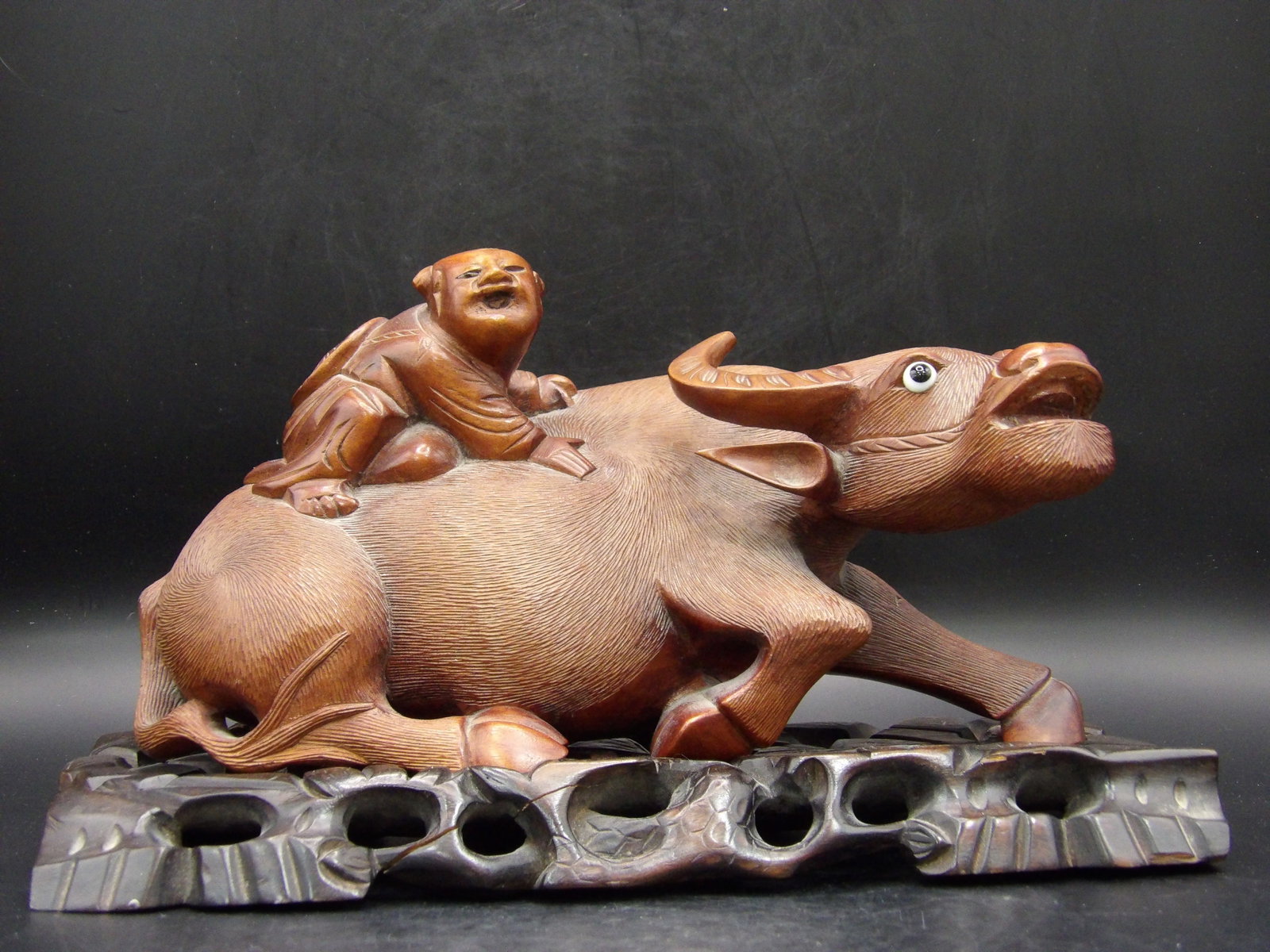 Chinese carved Boy Riding Water Buffalo statue custom ornate base 9 inches length: 9 x 4 x 4.5 inches. Custom ornate stand. Old wood crack line shown in the picture. We will inhouse ship items to you very affordable and efficient. Select self-arrange shipping.