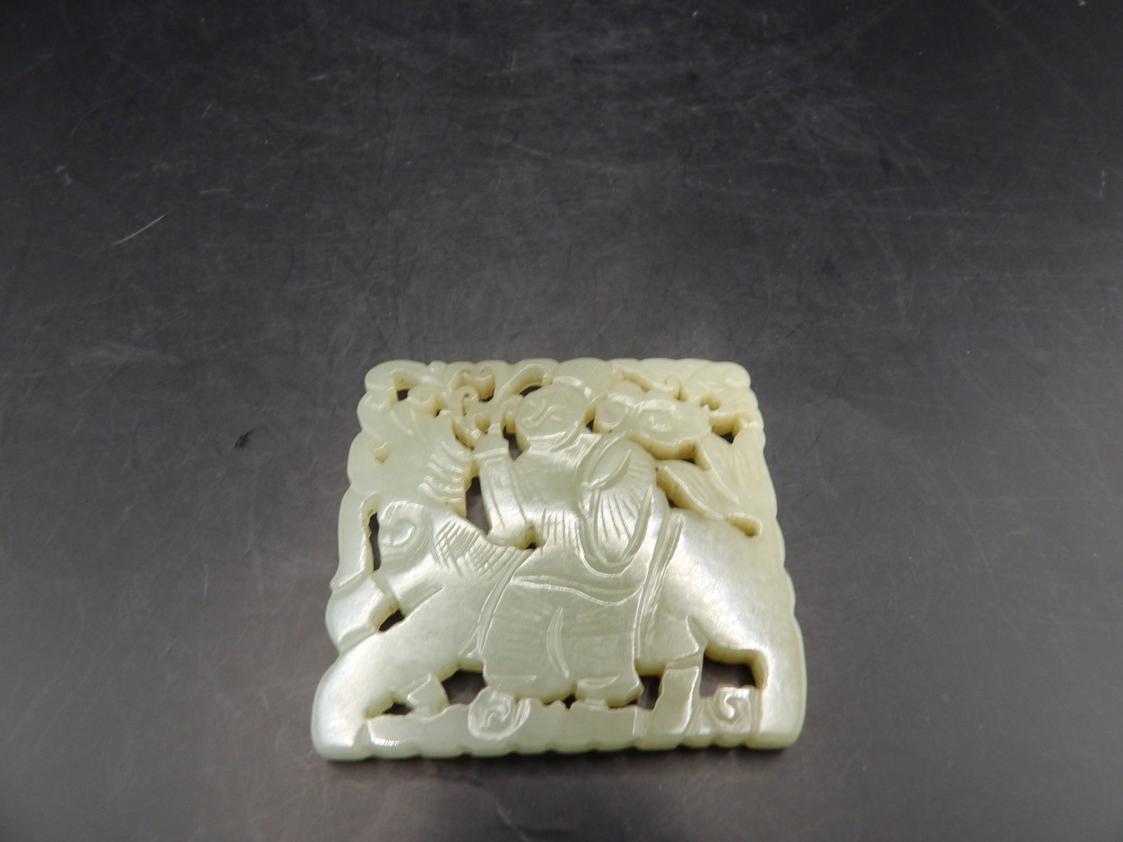 Qing dynasty antique Chinese Nephrite Jade Plaque Carving: Carved on both sides a woman holding flowers riding a beast. 2 inches length. 34 grams. We will inhouse ship items to you very affordable and efficient. Select self-arrange shipping.