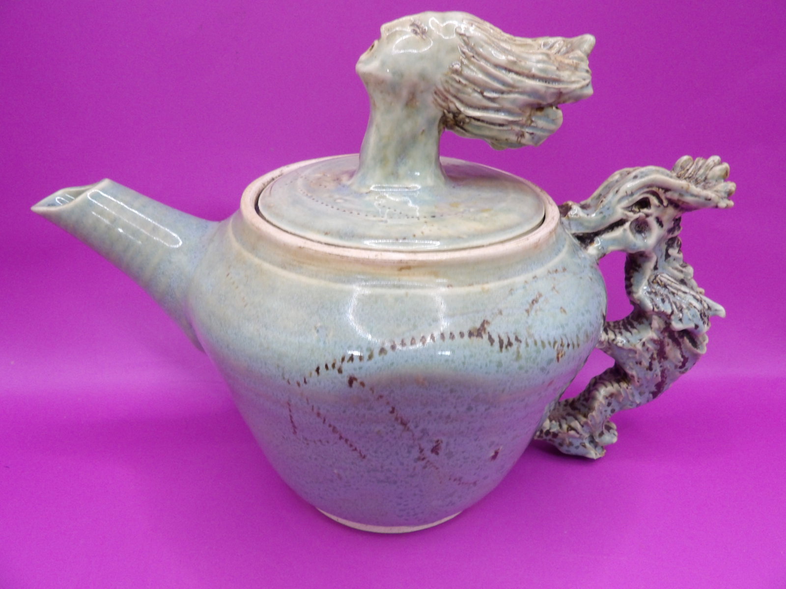 unique ceramic teapot with a sculpted face and dragon handle signed: 8.5 inches length. We will inhouse ship items to you very affordable and efficient. Select self-arrange shipping.