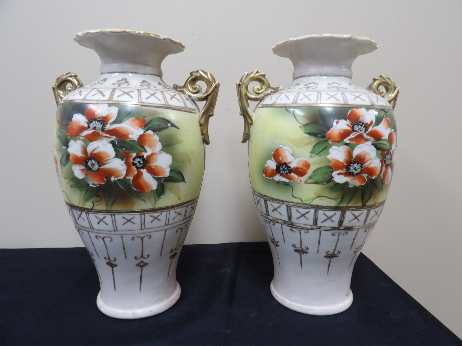 pair of antique hand painted Nippon vases with floral motif and gold handles: 12.5 inches height. We will inhouse ship items to you very affordable and efficient. Select self-arrange shipping.