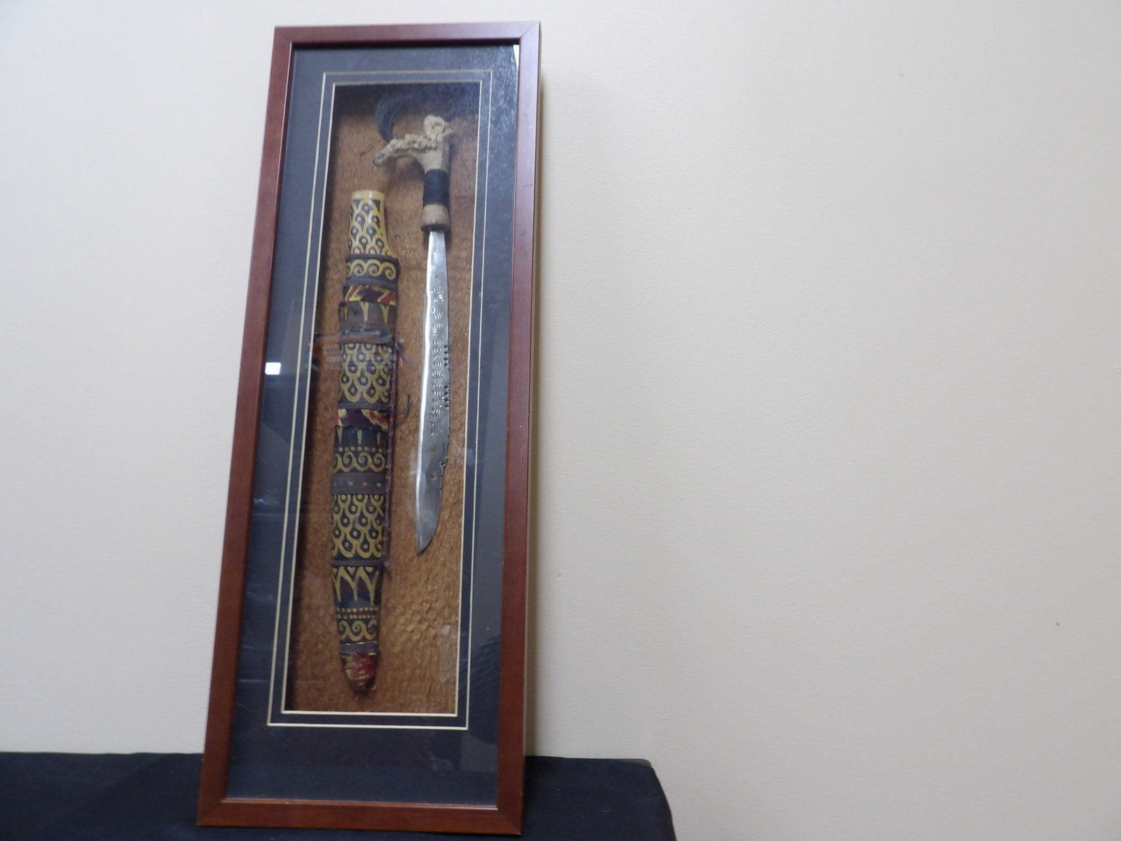 framed Dayak Parang Ilang knife and sheath with intricate decorations: Shadow box is 26.7 inches height. We will inhouse ship items to you very affordable and efficient. Select self-arrange shipping.