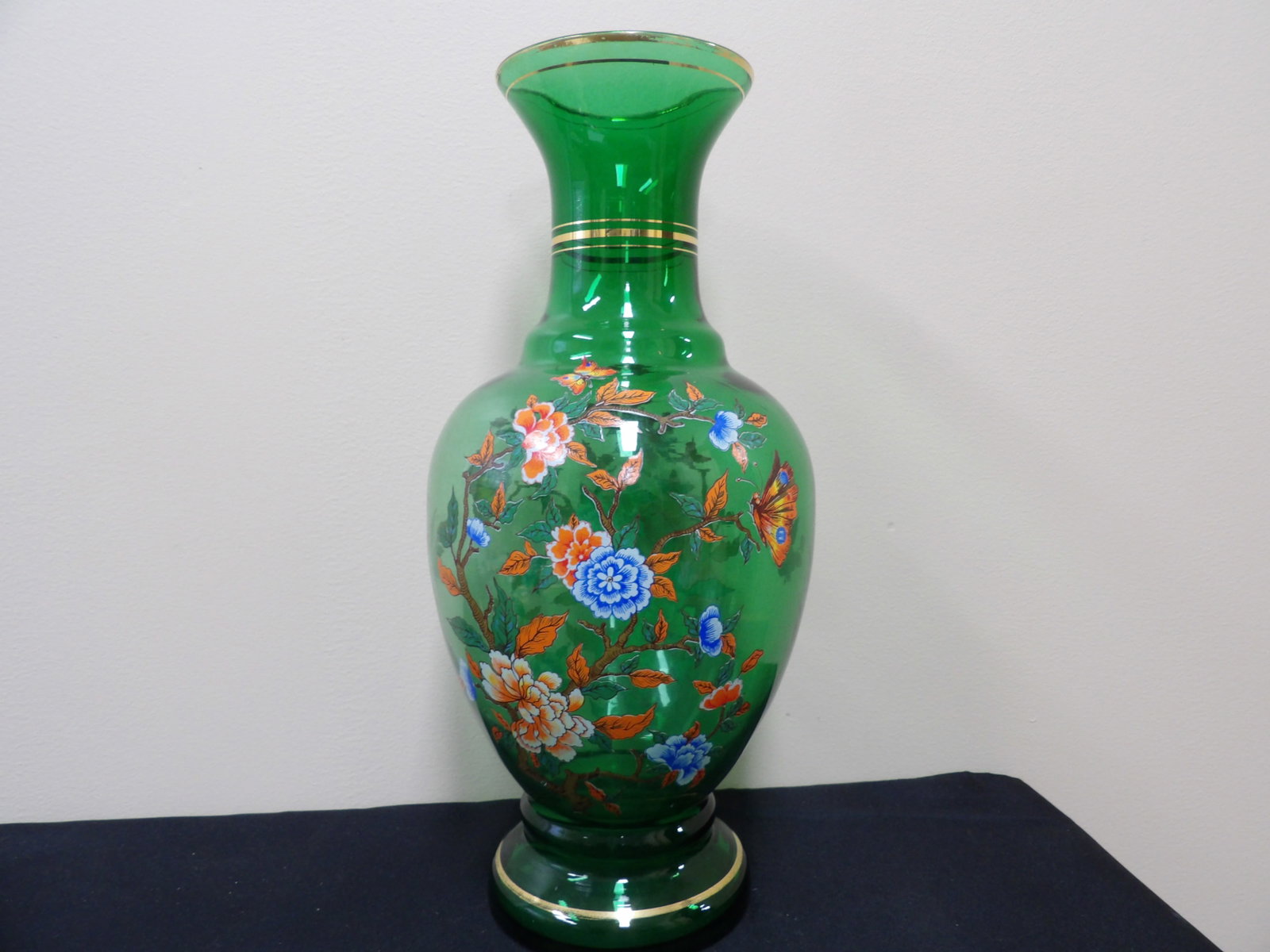 hand painted emerald green glass vase with floral and butterfly motifs: Approx. 16 inches height. Probably Italian. We will inhouse ship items to you very affordable and efficient. Select self-arrange shipping.