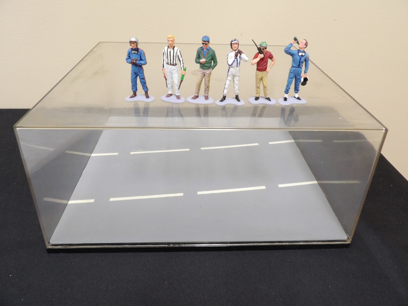 Acrylic display case with a road themed base plus 6 miniature figures: Case size is 12 x 10.3 x 5.6 inches. Figures are approx 2.2 inches height.