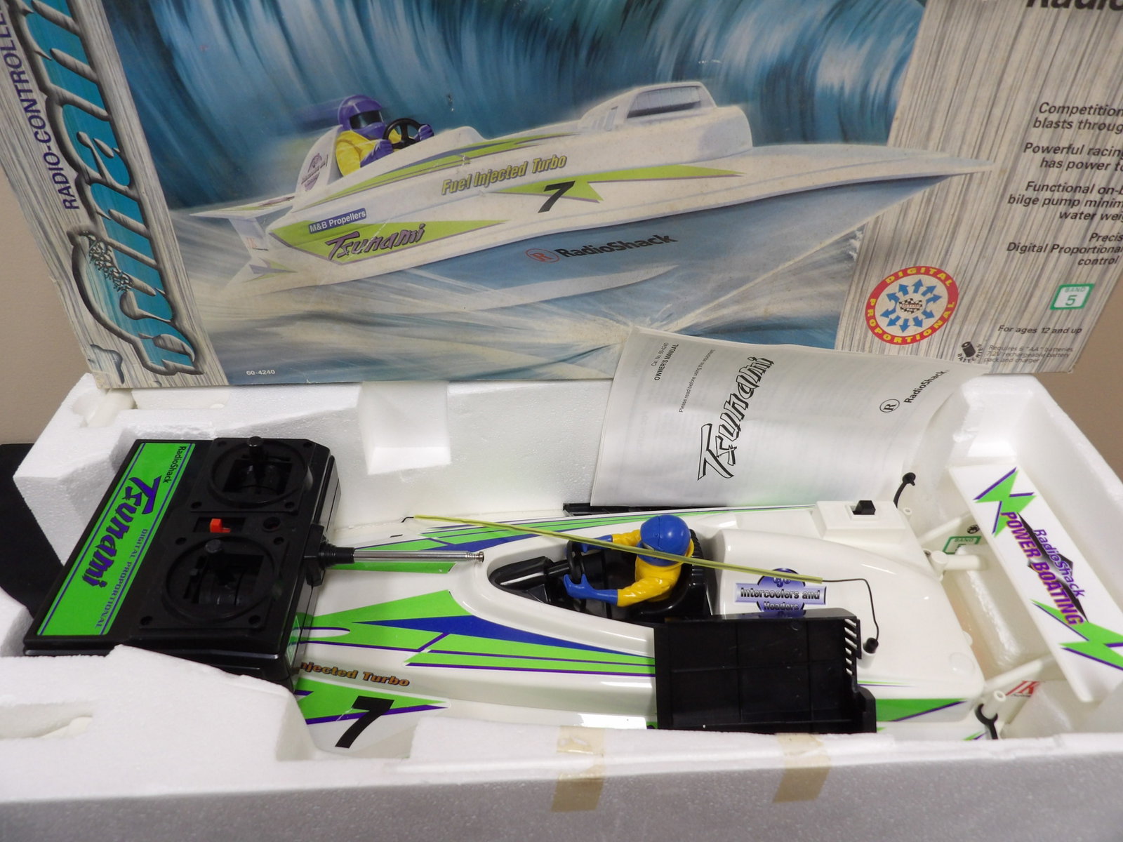 RadioShack Tsunami 60-4240 radio-controlled competition race boat: Approx 23 inches length.