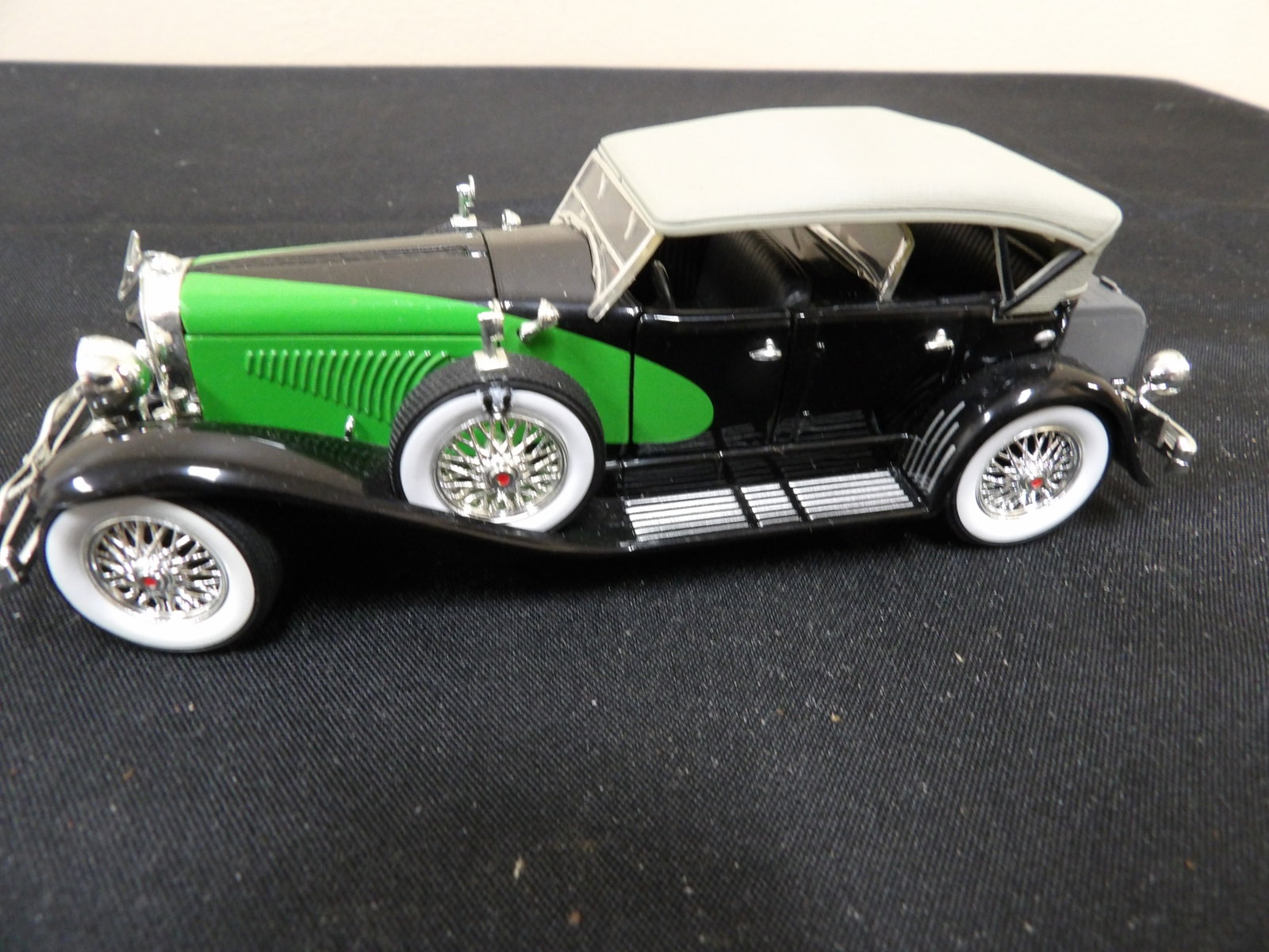 1:32 scale diecast model of 1934 Duesenberg automobile: 6 inches length.