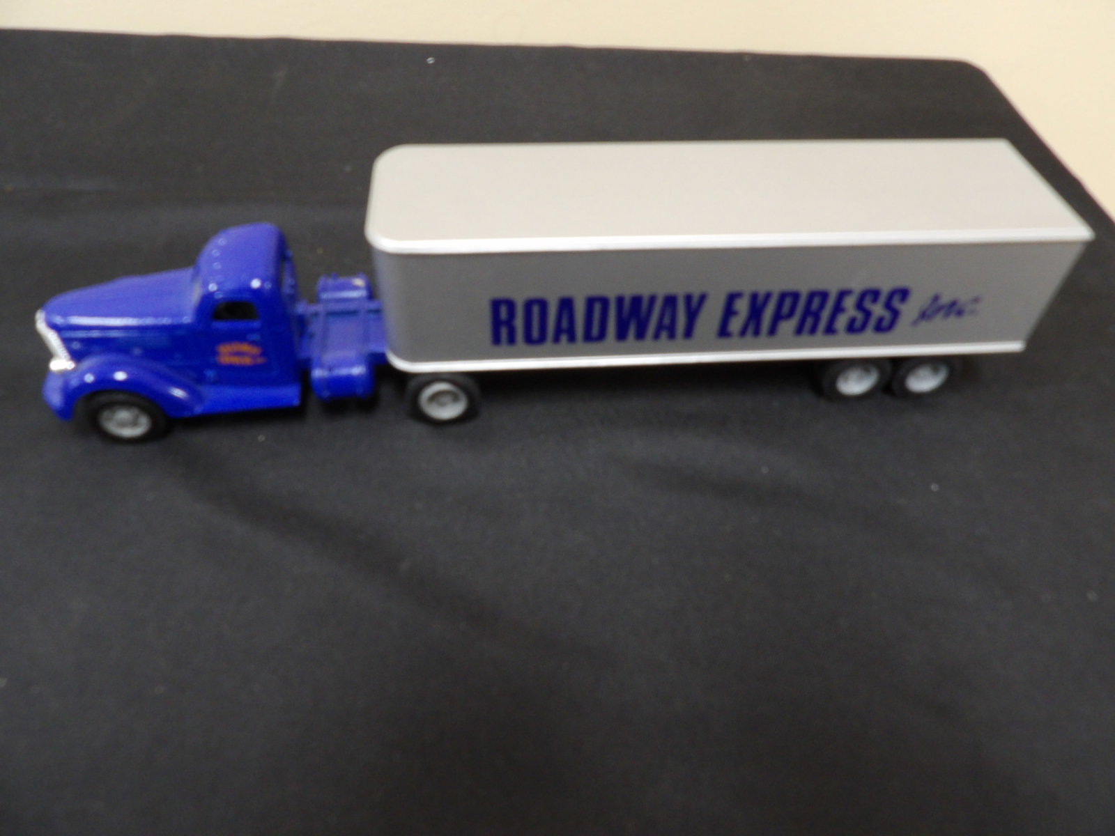 ERTL Roadway Express Inc die-cast semi-truck and trailer model: 12 inches length.