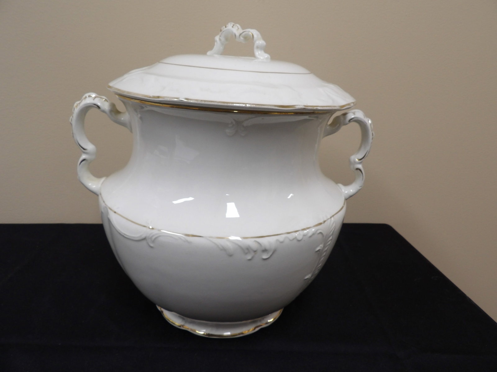 antique Harvard England white tureen with gold trim and embossed floral design: Approx. 12 inches height.