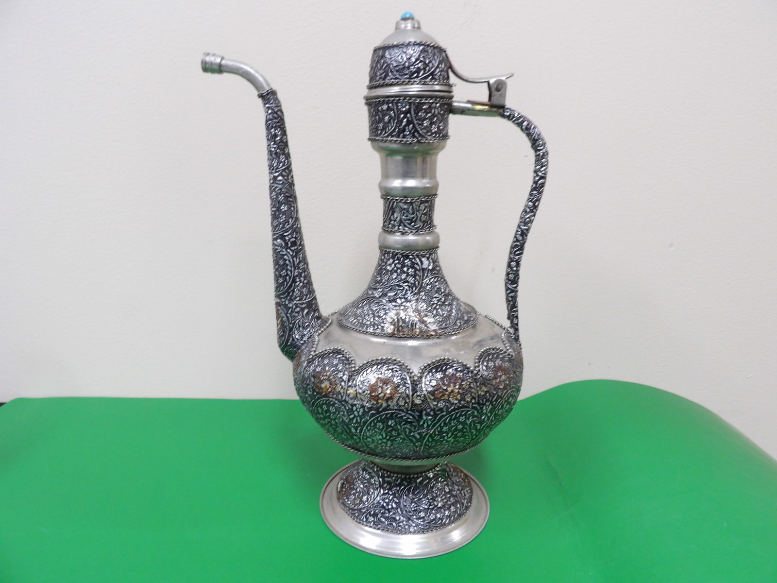 ornate Middle Eastern metal pitcher with inlaid and intricate engraving (1 of 8)