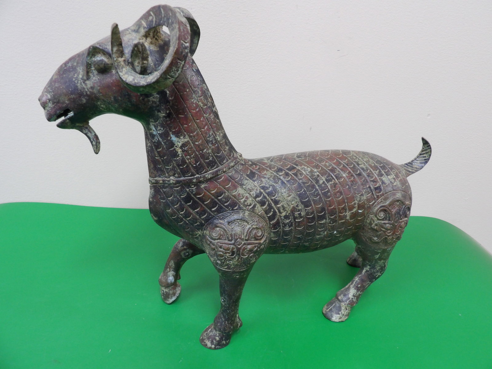 Chinese fine bronze sculpture of a ram with intricate scale and decorative motifs: 13 inches length. 4.2 lbs.