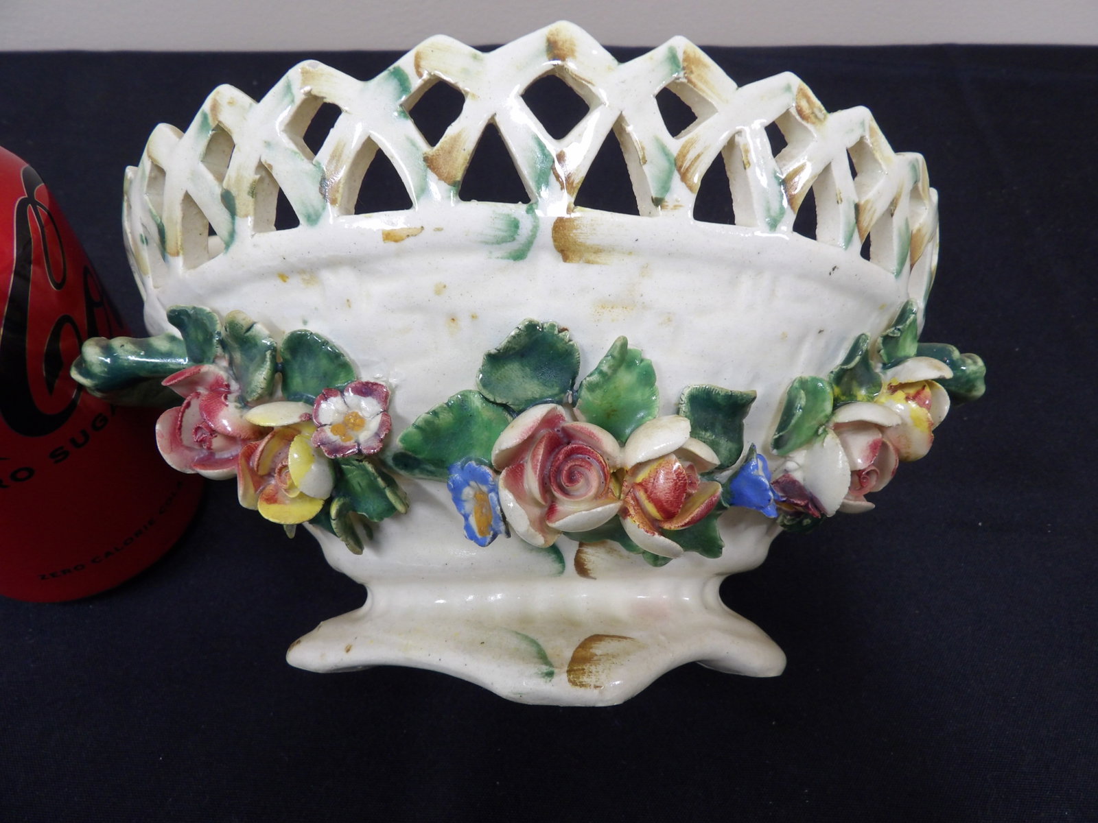 ornate Italian reticulated porcelain bowl with applied hand painted flowers: 8 inches length.