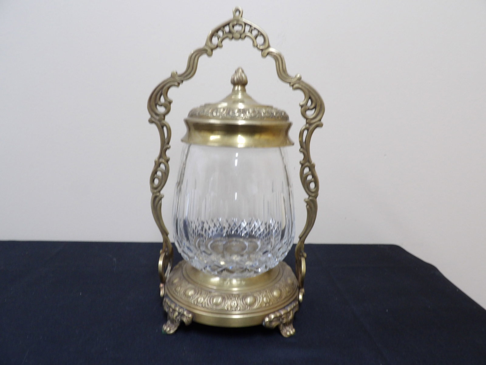 Castilian Imports cut crystal jar with ornate bronze pedestal and lid: 13.6 inches height.