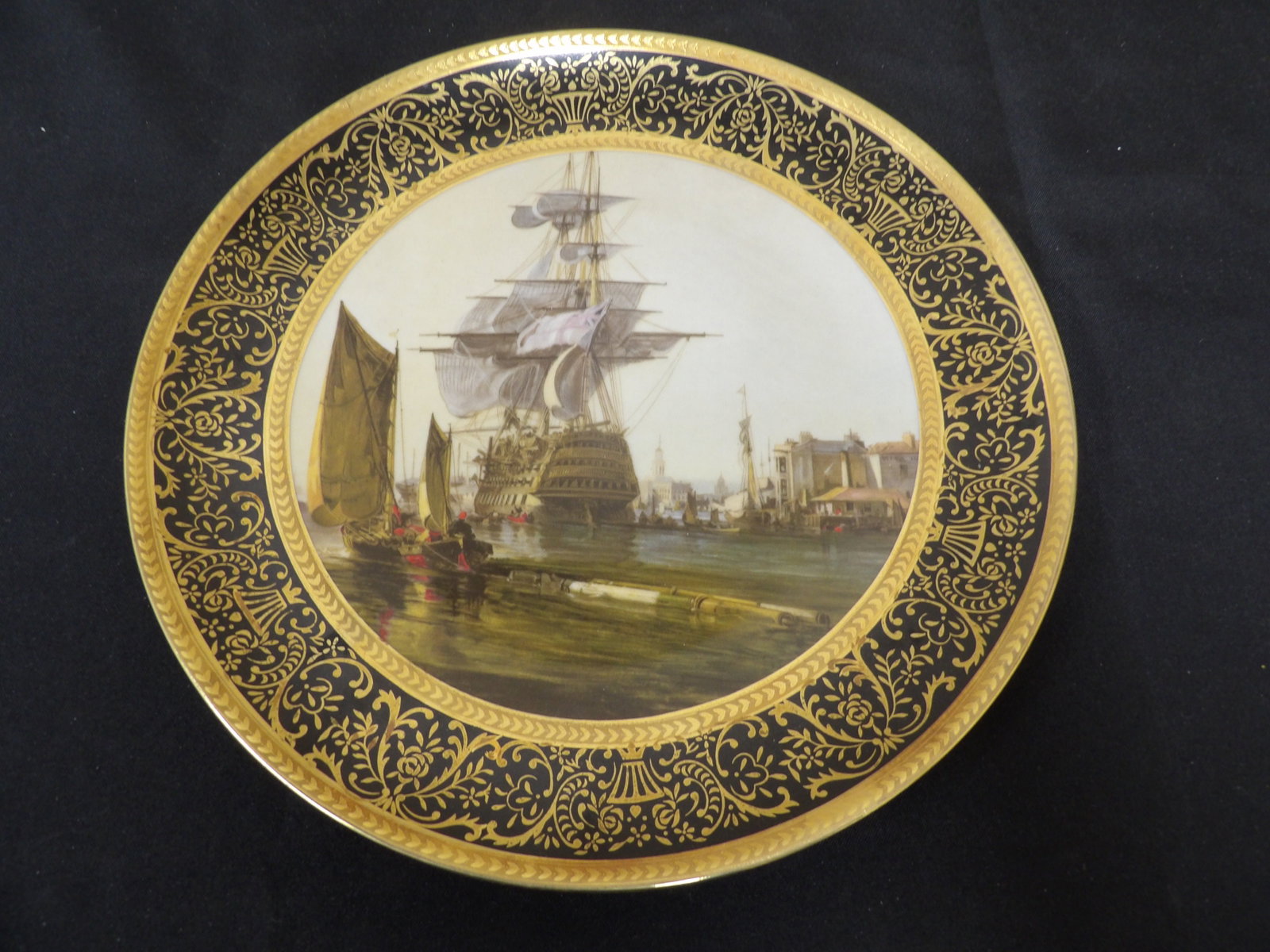 Royal Europe large porcelain plate with maritime scene and gold trim: 10.4 inches diameter.