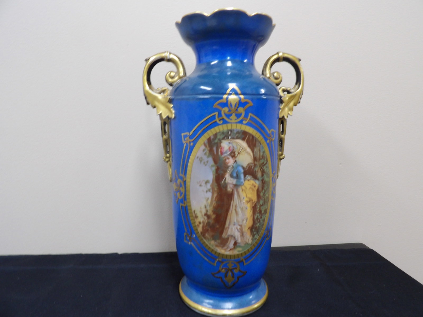 19th century French porcelain vase with gilt handles and painted scene: 15 inches height. We will inhouse ship items to you very affordable and efficient. Select self-arrange shipping.