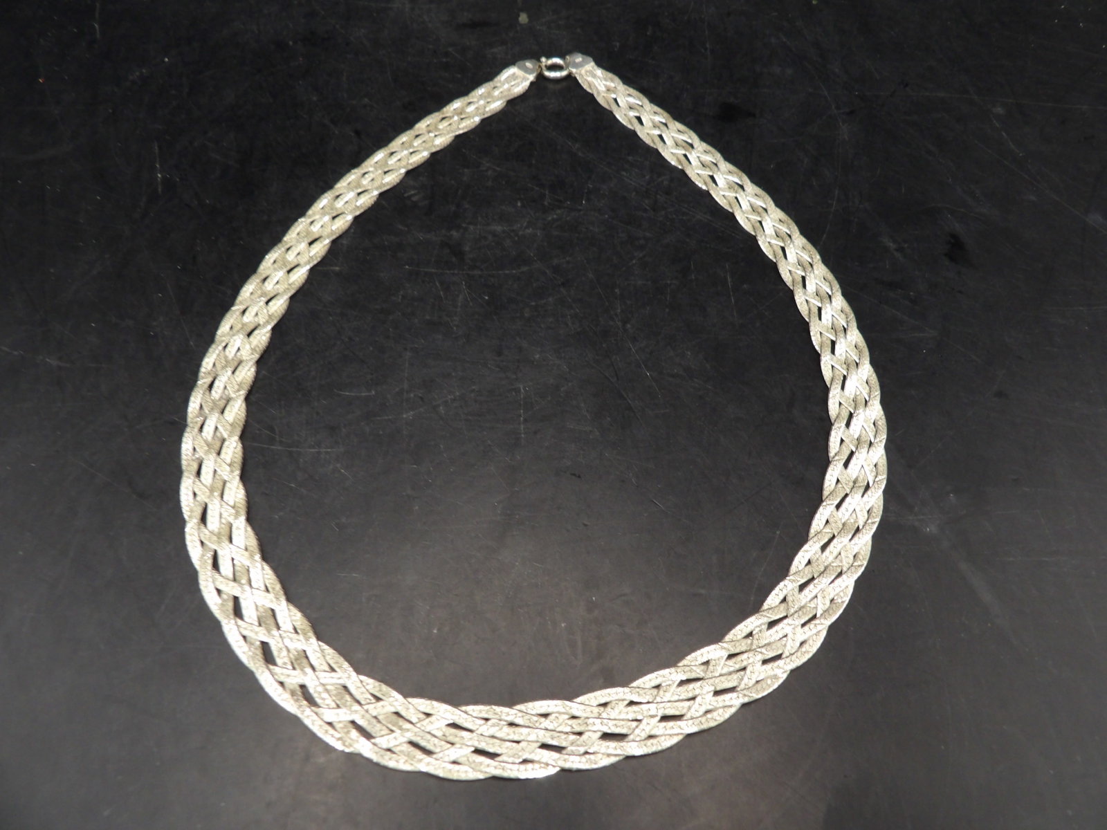 Italian marked 925 sterling silver braided herringbone chain necklace: Marked 925 and Italy. 18 inches length. 21 grams. We will inhouse ship items to you very affordable and efficient. Select self-arrange shipping.