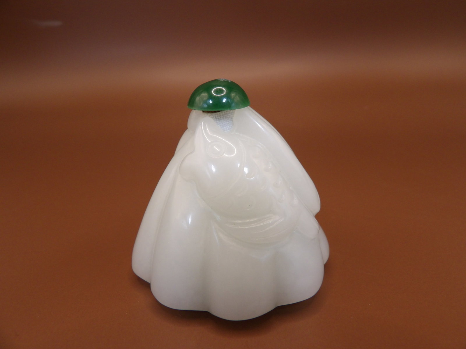 Chinese white jade carved lotus fish motifs snuff bottle: Approx. size is 1.8 x 1.8 x 1.6 inches.