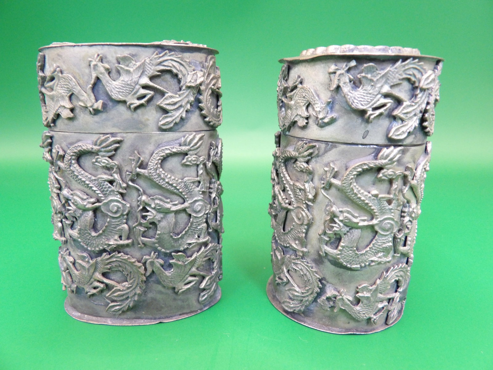stamped silver in Chinese on the bottom lot of 2 dragon snuff bottles: Taller one is 2.4 inches height.