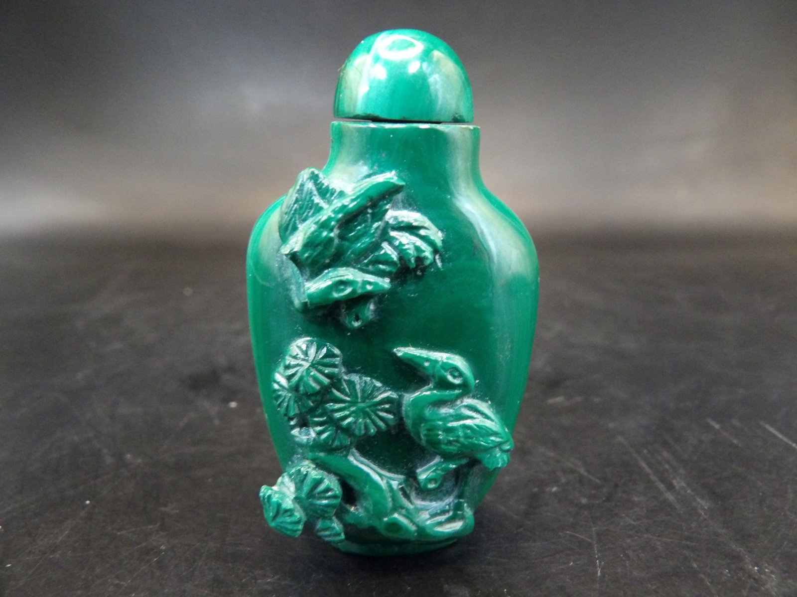 antique Chinese malachite snuff bottle with prunus blossom and crane motifs: 2 inches height.