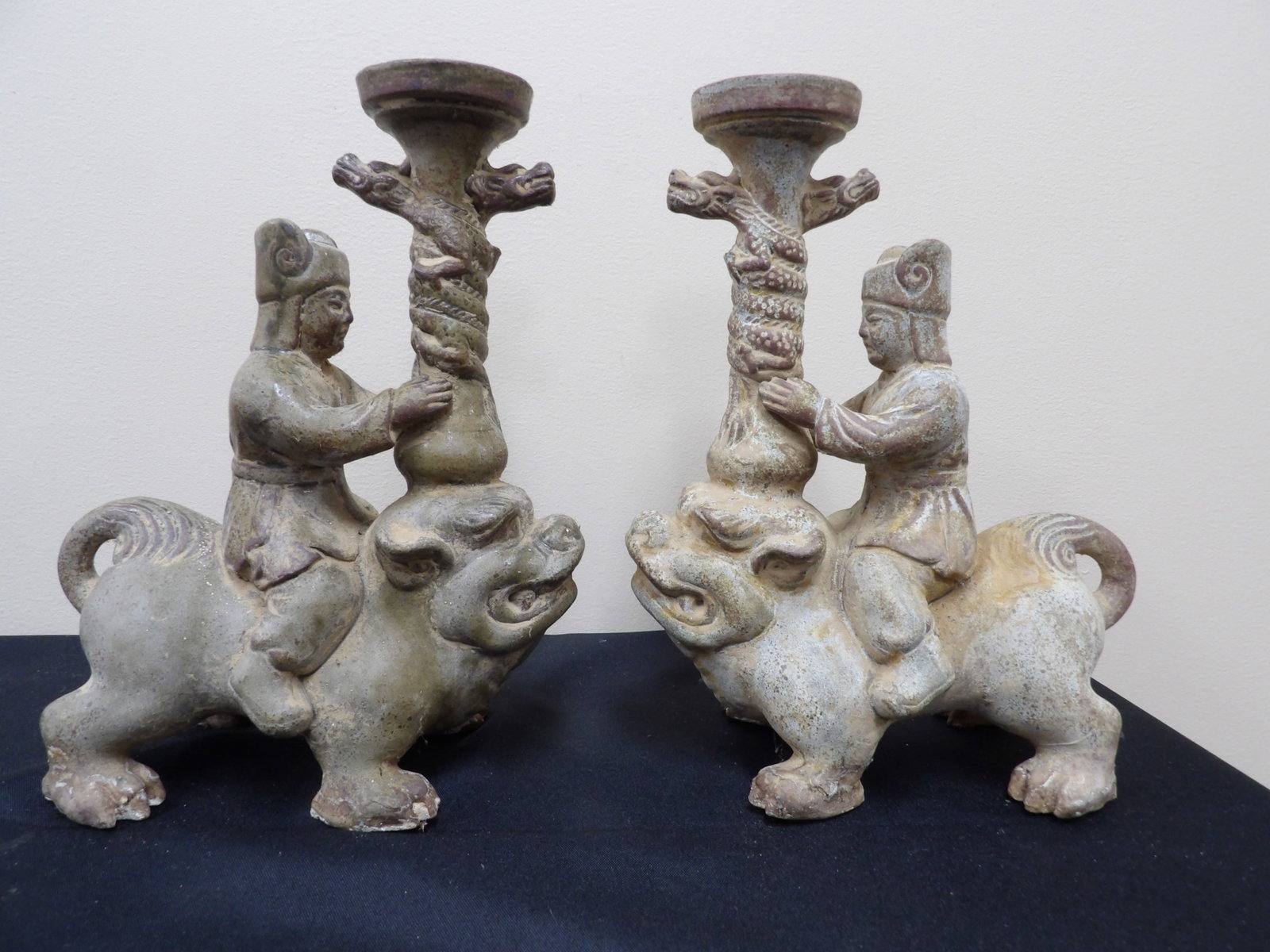 pair of chinese antique terracotta candle holders with figures on mythical beasts: Approx. 10 inches height. From Atlanta, Georgia estate. We will inhouse ship items to you very affordable and efficient. Select self-arrange shipping.