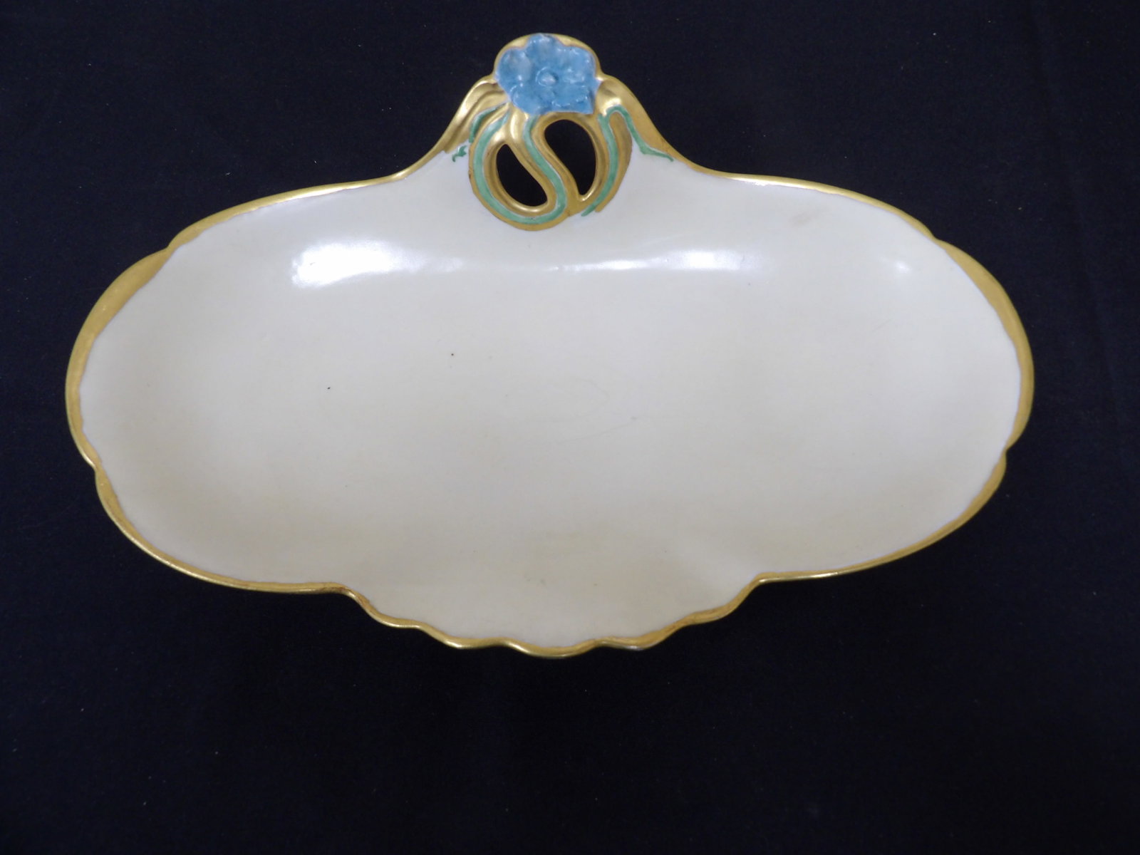 antique Limoges decorative long dish with gold trim and stylized motif signed: 12 inches length.