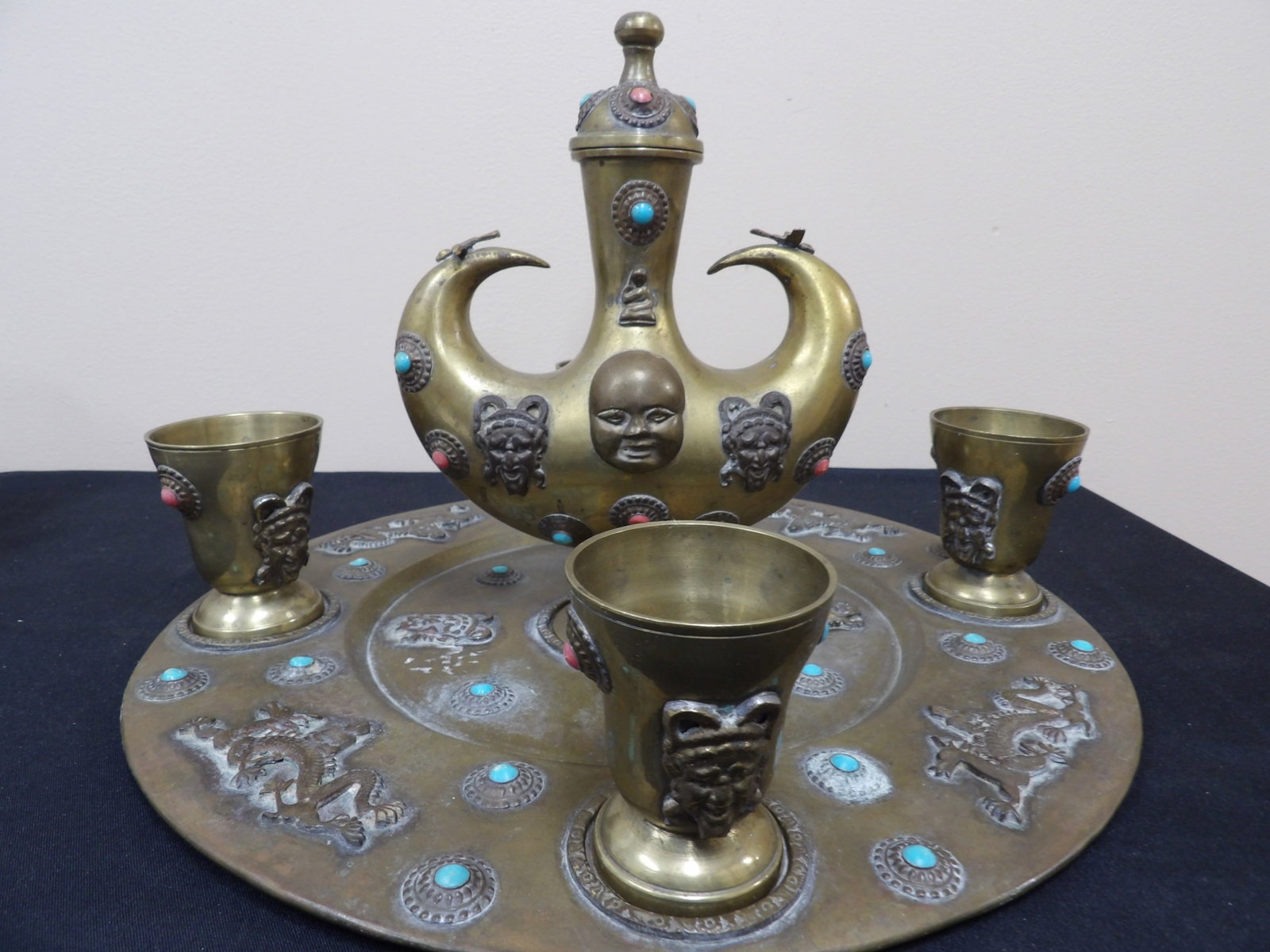 antique Turkish or Tibetan brass beverage set with cups featuring dragon motif and inlaid details: Large serving tray is 15.3 diameter. Believed to be from late 1880s.