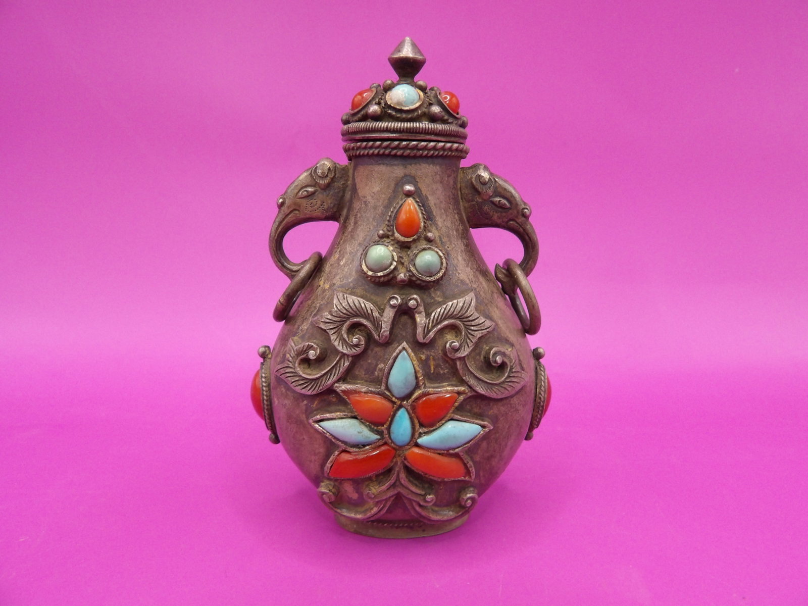 ornate antique Asian inlaid metal snuff bottle with elephant ears and rings: 3.2 inches height.