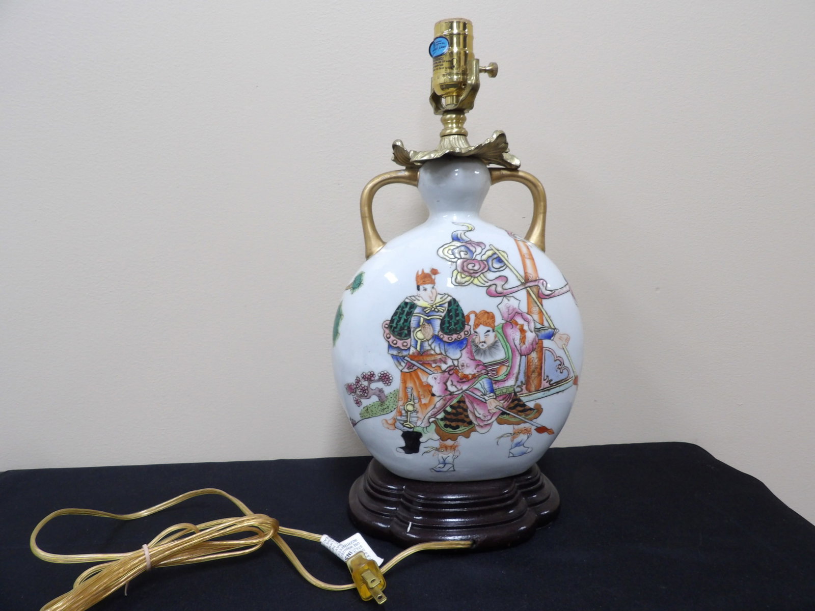 Chinese famille rose style porcelain small lamp with figural decoration and brass fittings: 16 inches height.