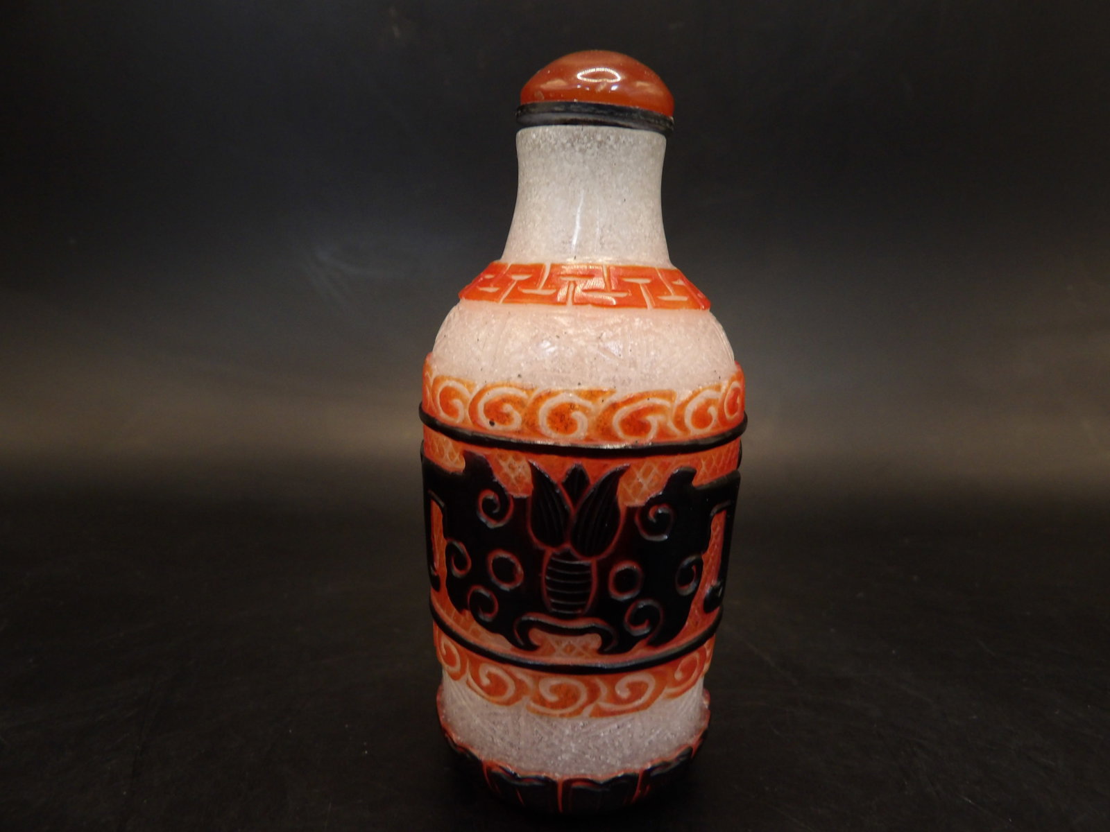 Qing dynasty Chinese overlay glass mask face motif glass snuff bottle: 3.1 inches height.