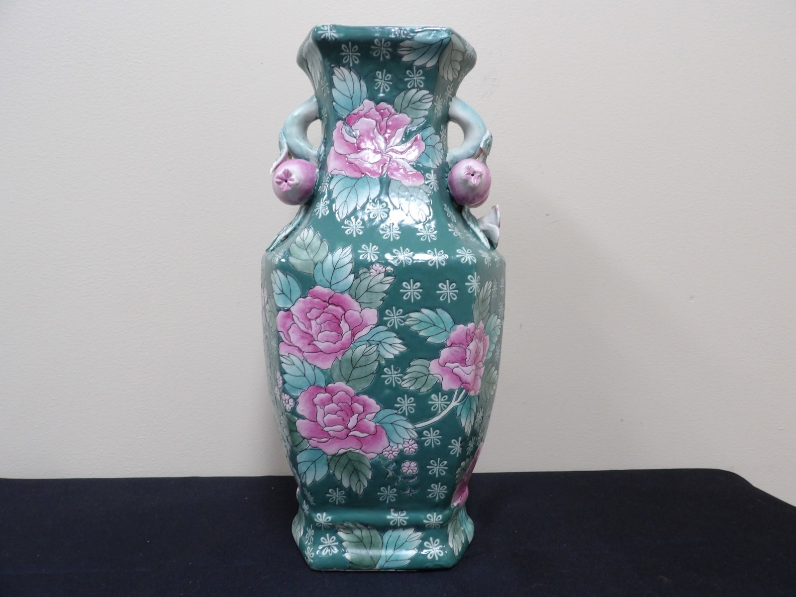 Asian green glazed porcelain vase with pink peonies and molded peach handles: 14.2 inches height.