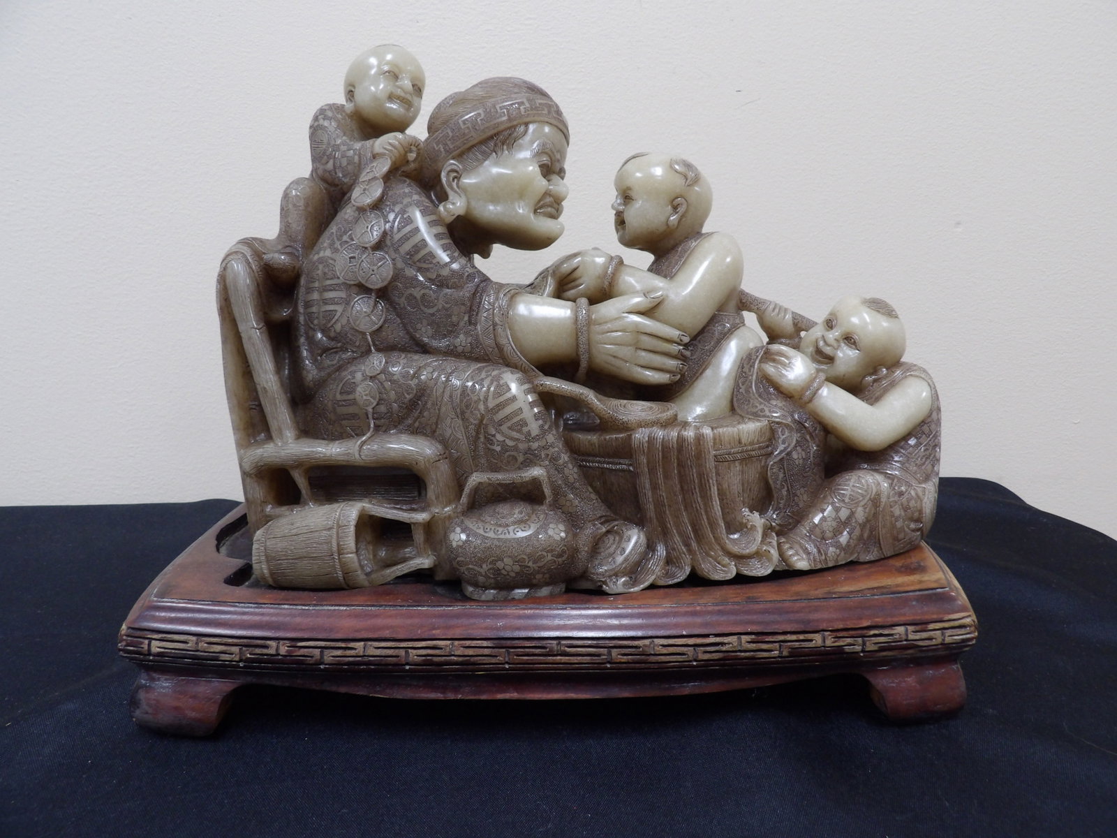 exceptional Chinese Shoushan stone carved figural group depicting an elder and children Heavy: 11 inches length sculpture on 12.5 inches wood base. Over 19 lbs.
