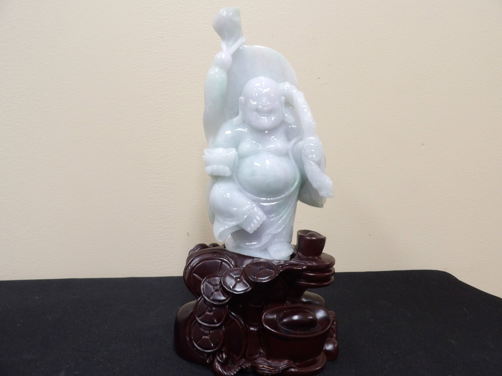 fine Chinese carved jadeite jade laughing buddha holding ingot on custom base: 10.4 inches height including base.