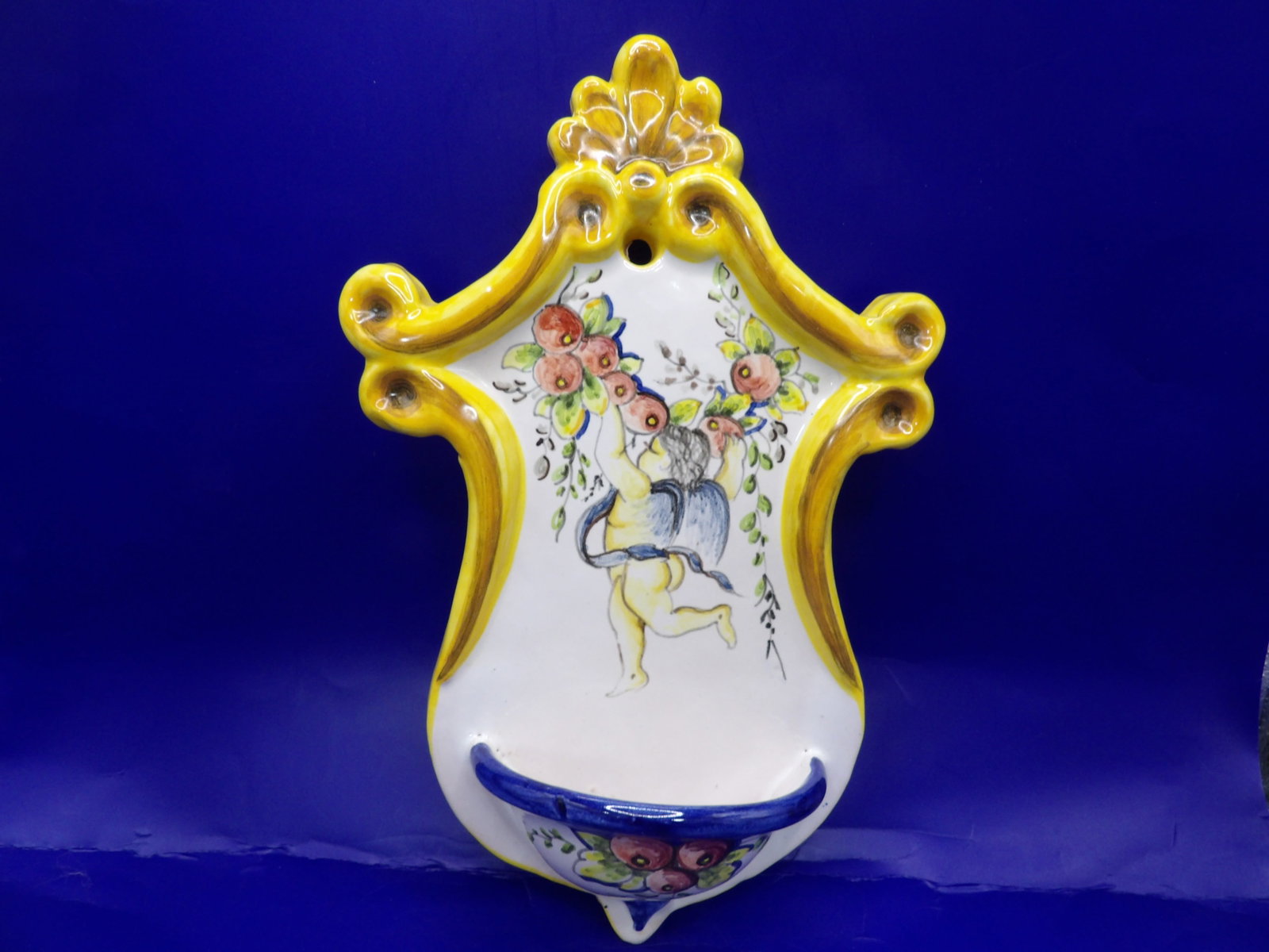 Ceramic holy water font style wall plaque with cherub and floral motif signed