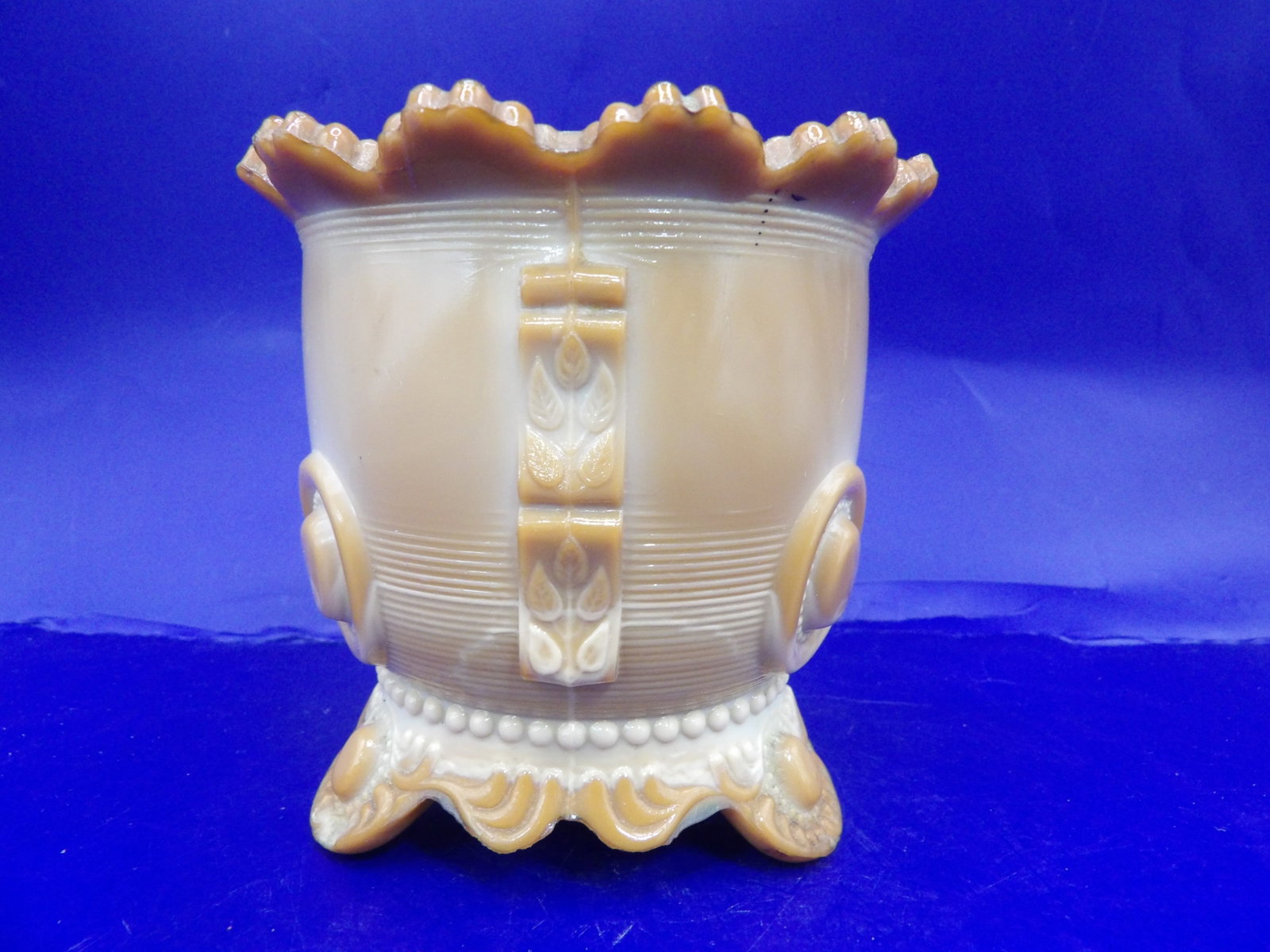 amber slag glass pot or sugar bowl with ruffled rim and ornate feet: 3.5 inches height.