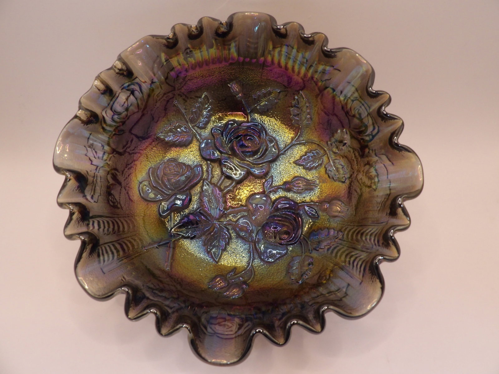 amethyst iridescent imperial glass open rose carnival glass footed bowl circa 1910-1930: Approx. 8 inches diameter.