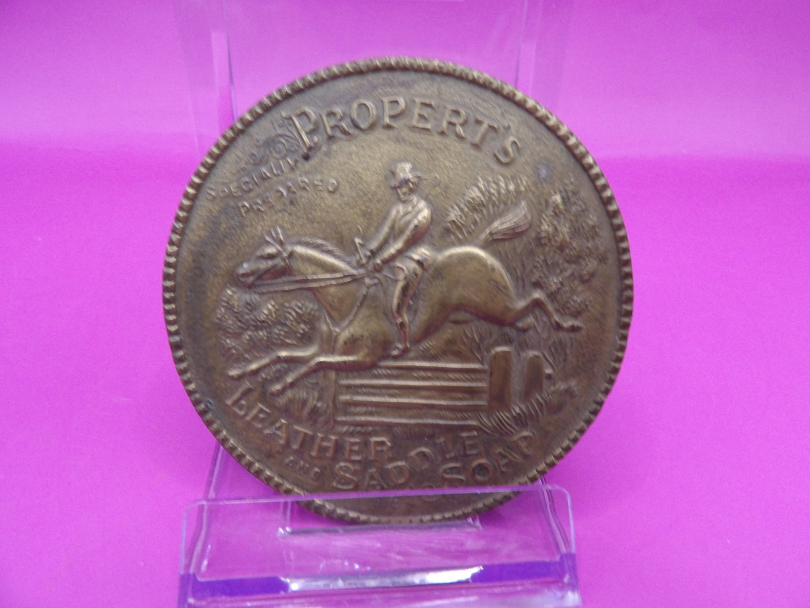 vintage Propert's leather and saddle soap promotion brass belt buckle: Approx. 3 inches diameter.