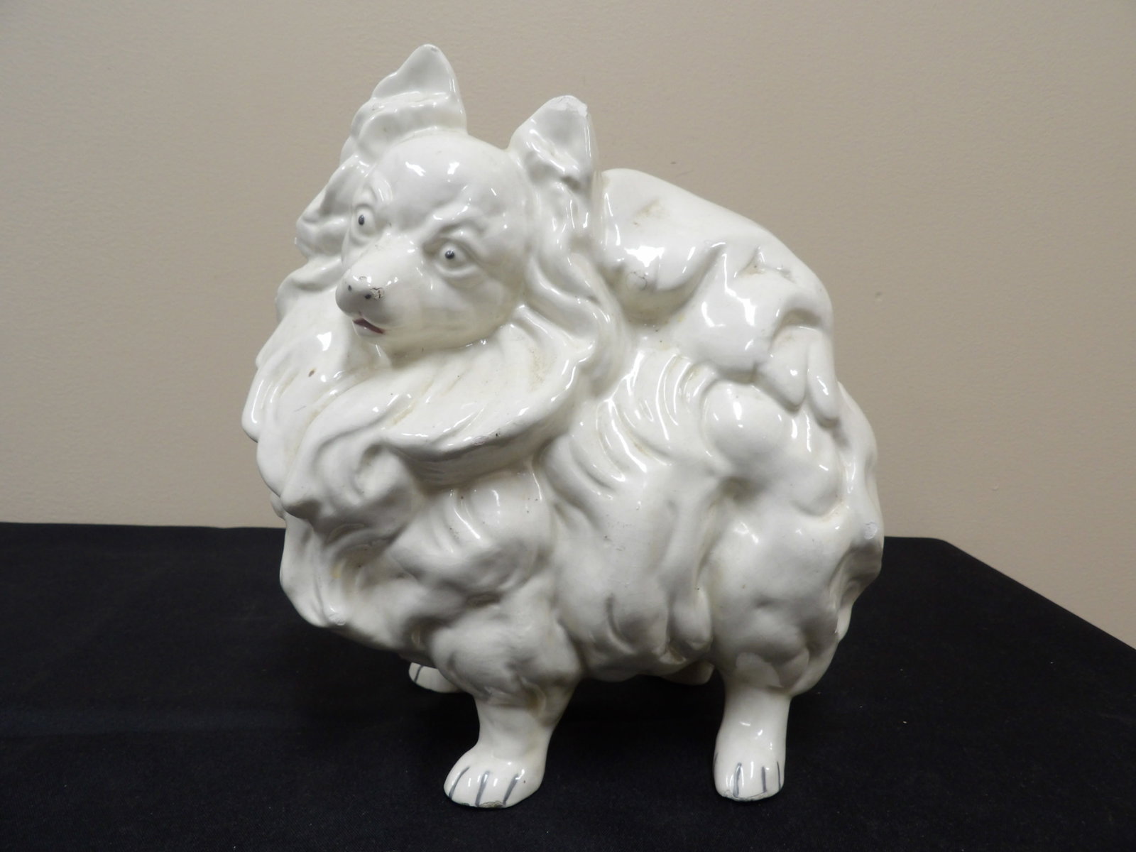 vintage white glazed ceramic pomeranian dog figurine