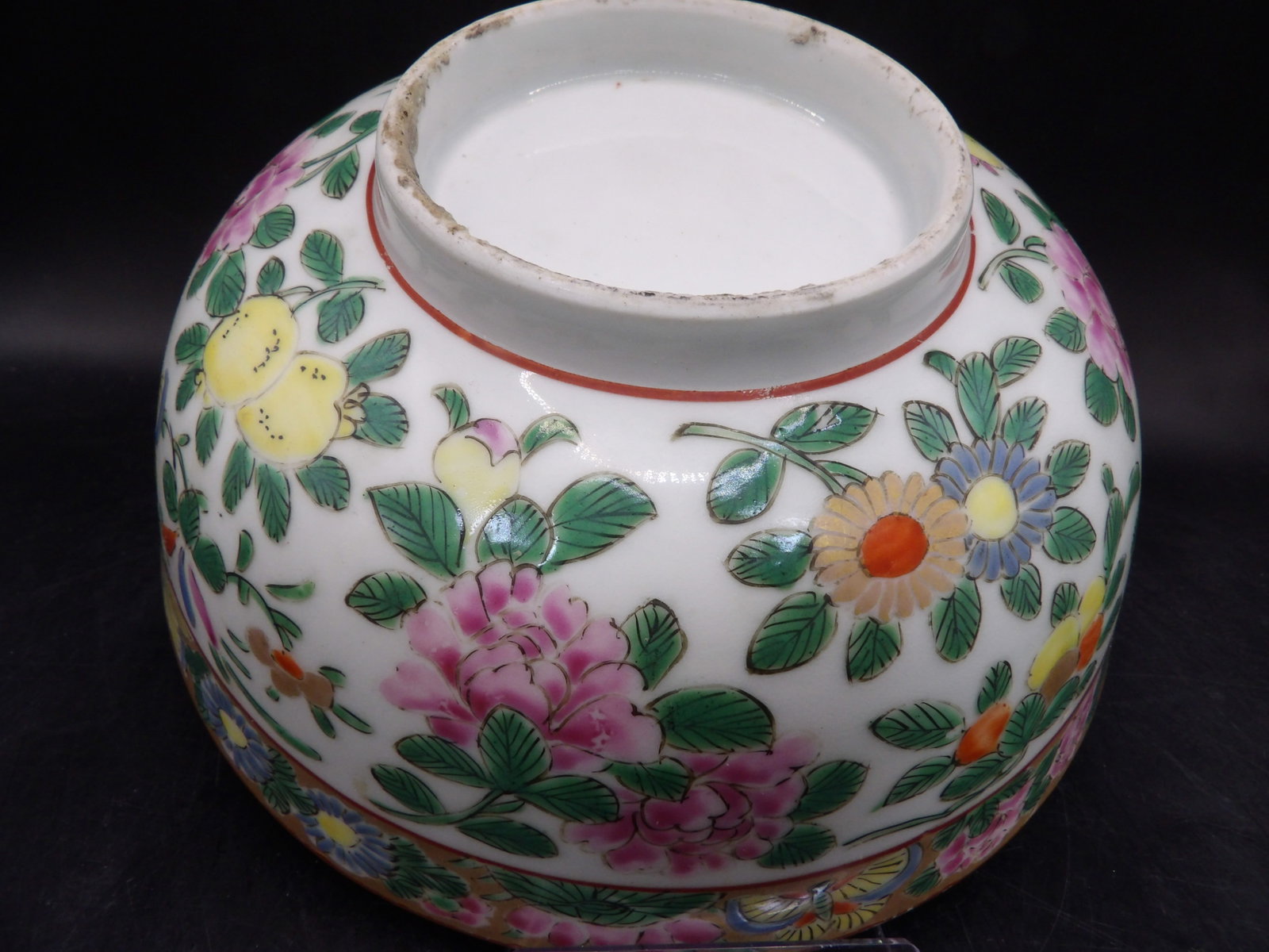 antique Chinese famille rose porcelain bowl with floral and butterfly decorations